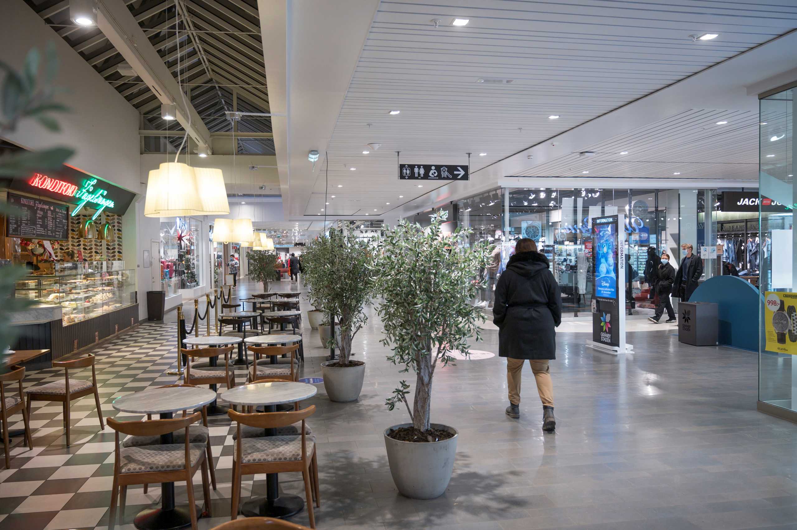 People walk at the Granbystaden shopping center, as the government announced new recommendations and restrictions to curb the spread of the coronavirus disease (COVID-19) pandemic, in Uppsala, Sweden, December 18, 2020. TT News Agency