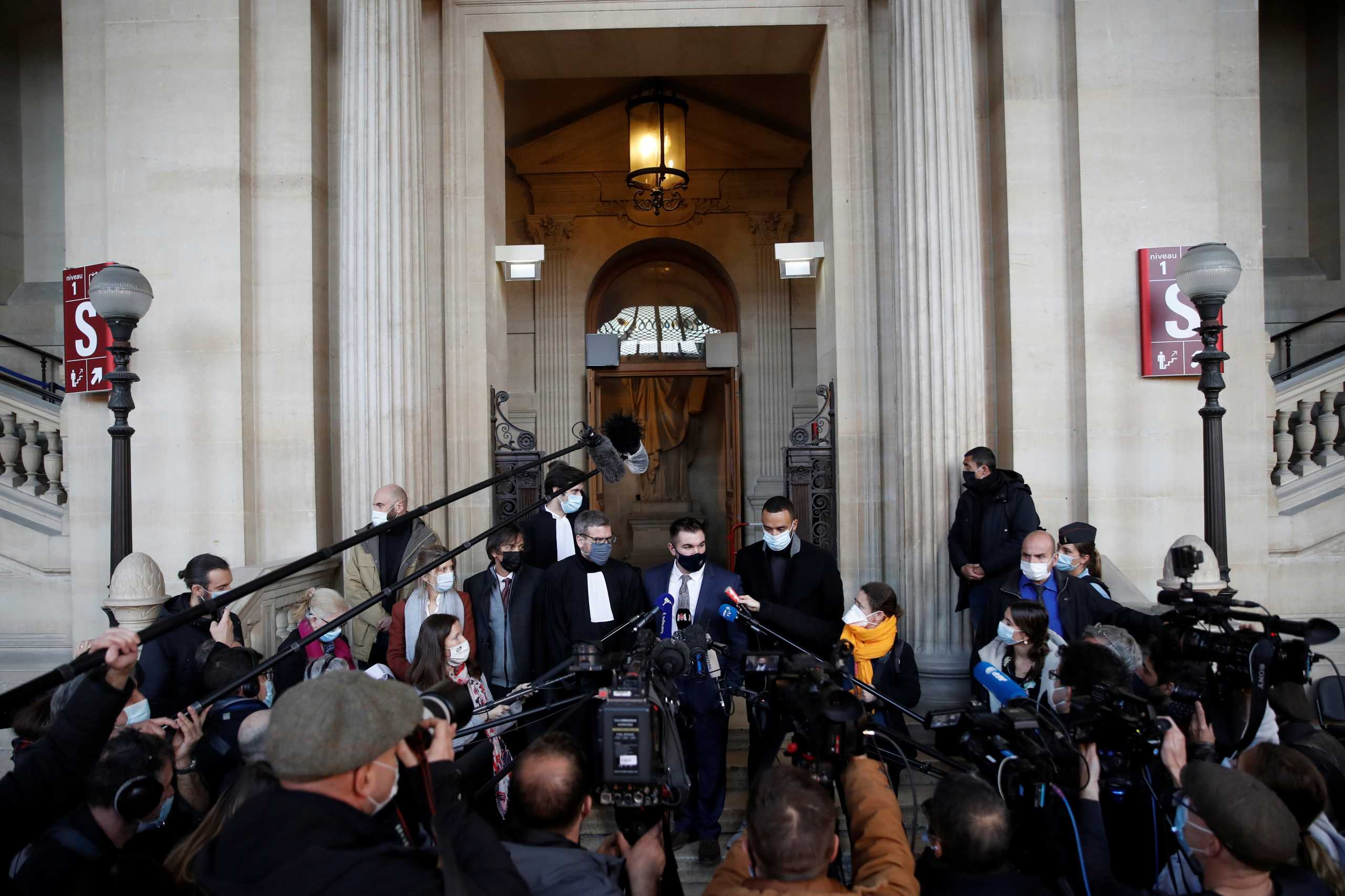 American citizens Anthony Sadler and Alek Skarlatos, two of the three American "heroes" of the Thalys train, Mark Moogalian, a U.S.-born Frenchman, his wife Isabelle Moogalian, and Thibault de Montbrial, French lawyer representing three American friends, talk to journalists after testiying during the trial of a suspected Islamist gunman who opened fire on a Thalys high-speed train between Amsterdam and Paris, at Paris courthouse, France, November 20, 2020. REUTERS