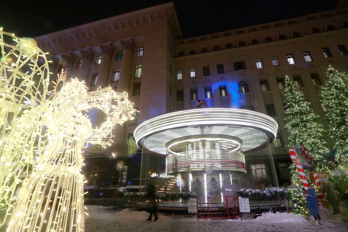 General view shows a Christmas fair in front of the presidential office building in Kyiv, Ukraine December 23, 2020. Picture taken with long exposure. REUTERS