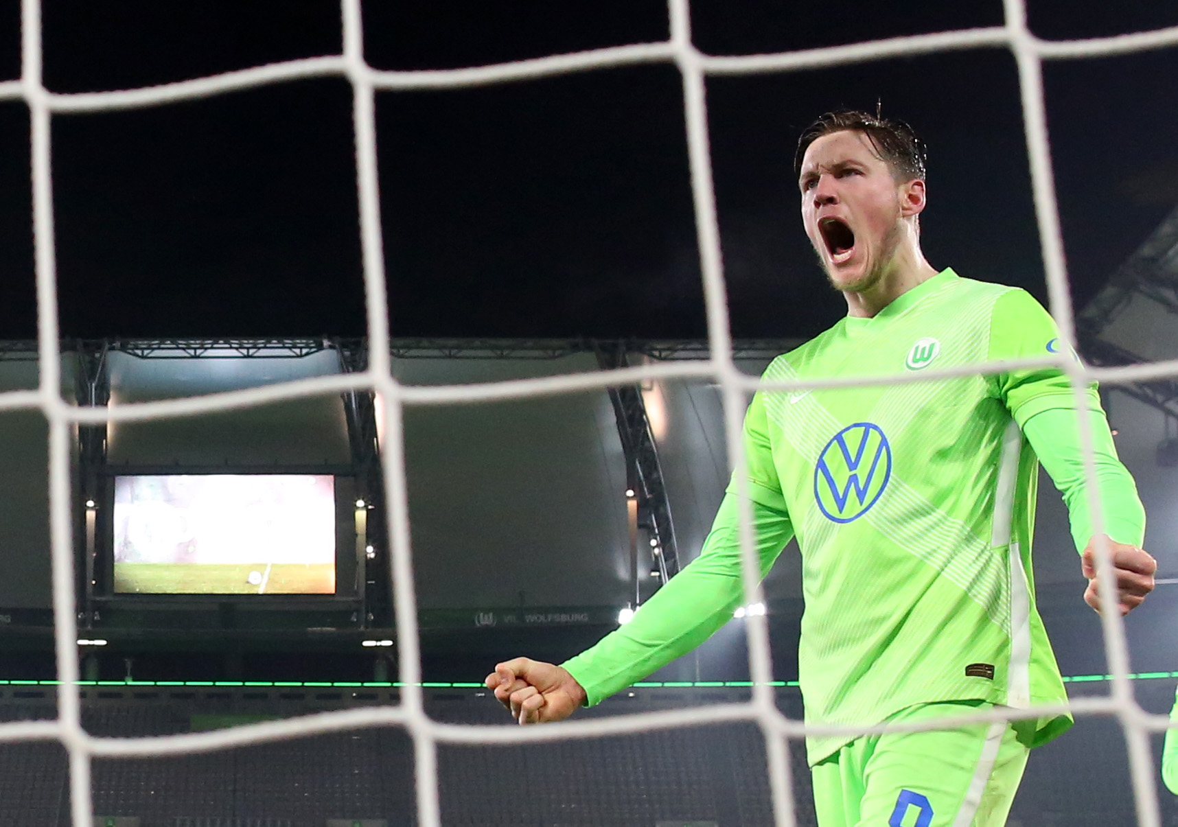 Soccer Football - Bundesliga - VfL Wolfsburg v Eintracht Frankfurt - Volkswagen Arena, Wolfsburg, Germany - December 11, 2020 VfL Wolfsburg's Wout Weghorst celebrates scoring their first goal Pool via REUTERS