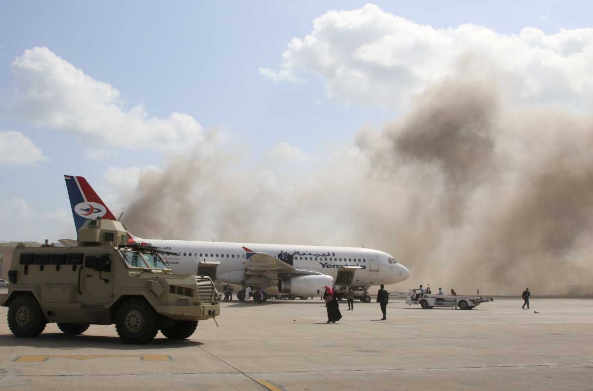 A military vehicle is seen on the tarmac during an attack on Aden airport moments after a plane landed carrying a newly formed cabinet for government-held parts of Yemen, in Aden, Yemen December 30, 2020. REUTERS