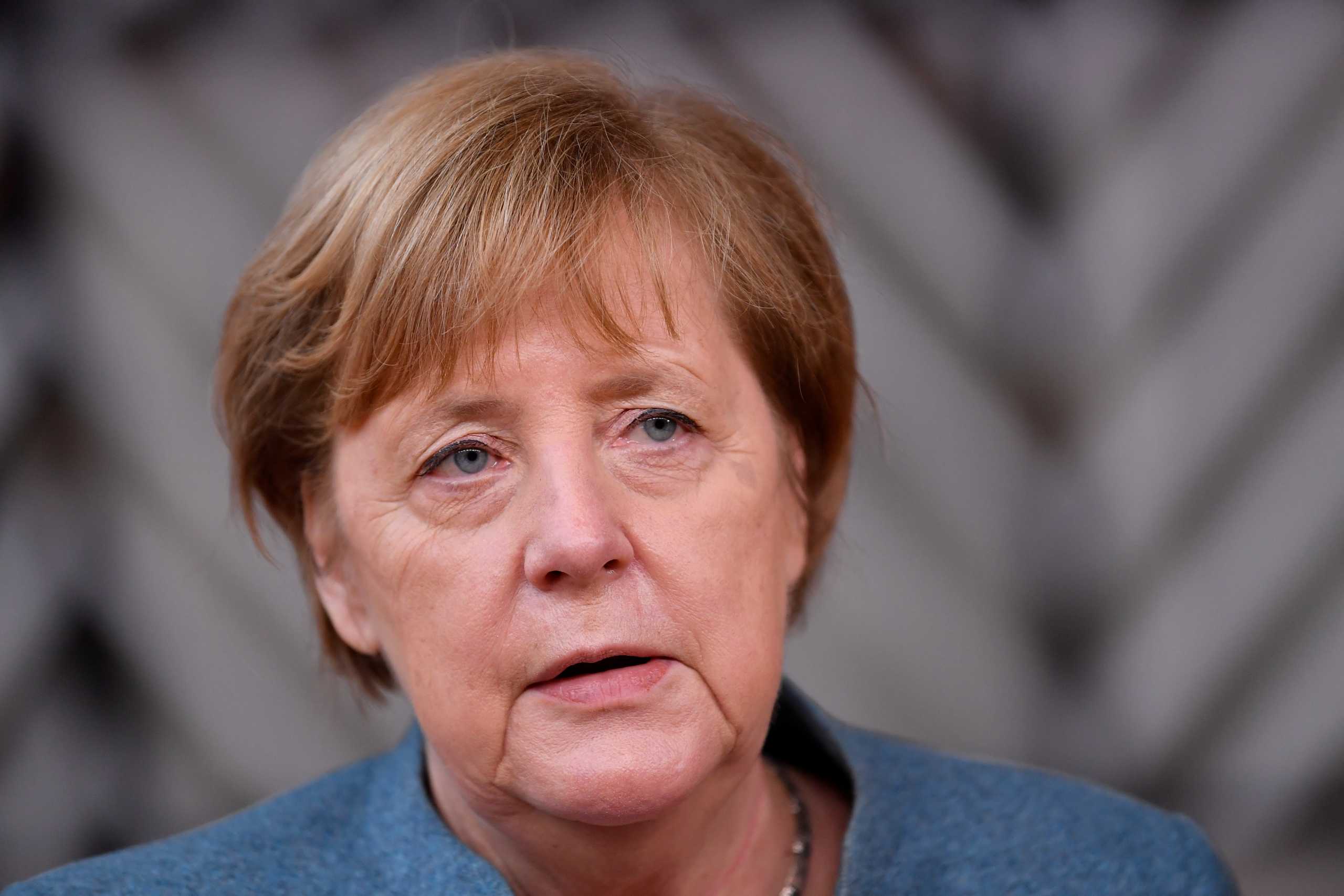 Germany's Chancellor Angela Merkel speaks as she arrives to attend a face-to-face EU summit amid the coronavirus disease (COVID-19) lockdown in Brussels, Belgium December 10, 2020. John Thys