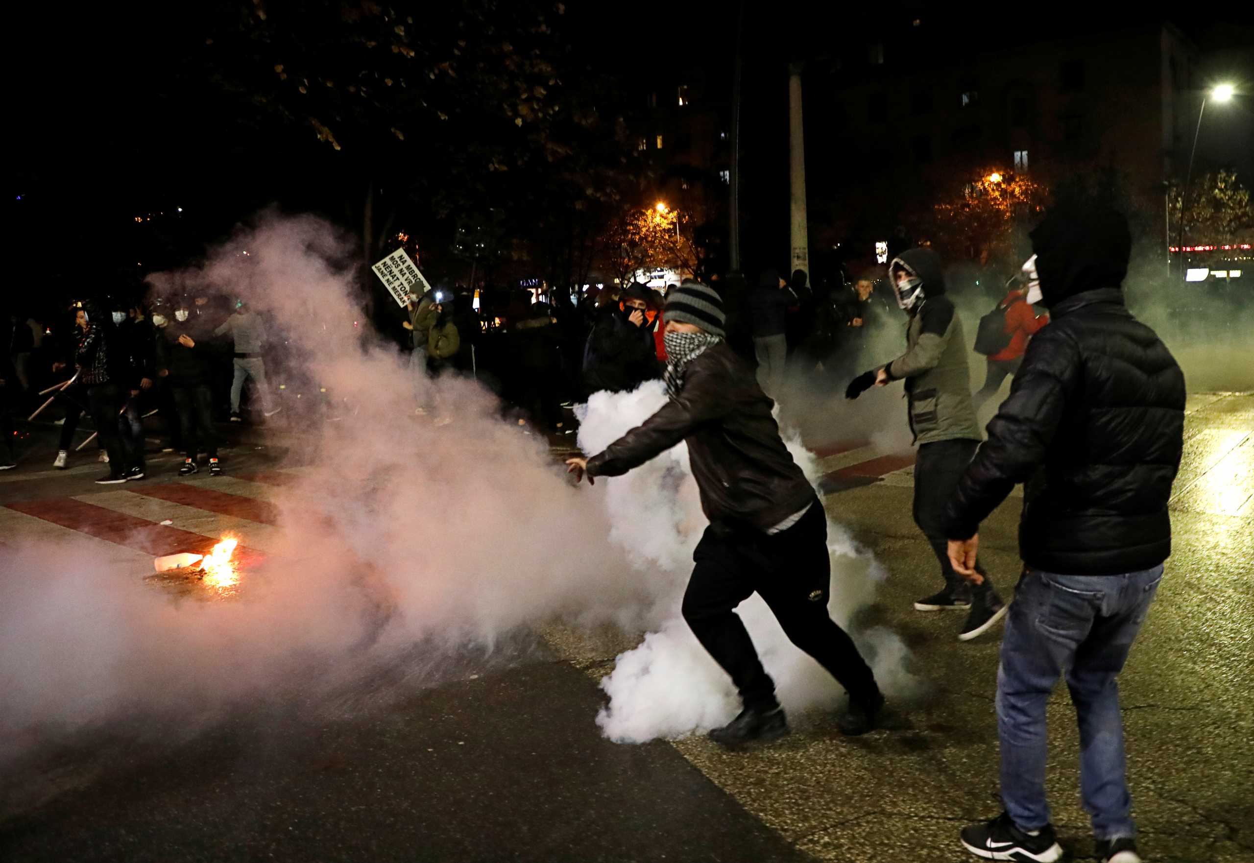 People attend a demonstration in reaction to the death of Klodian Rasha, after he was shot dead during the country's overnight curfew imposed due to the coronavirus disease (COVID-19), in Tirana, Albania, December 11, 2020. REUTERS
