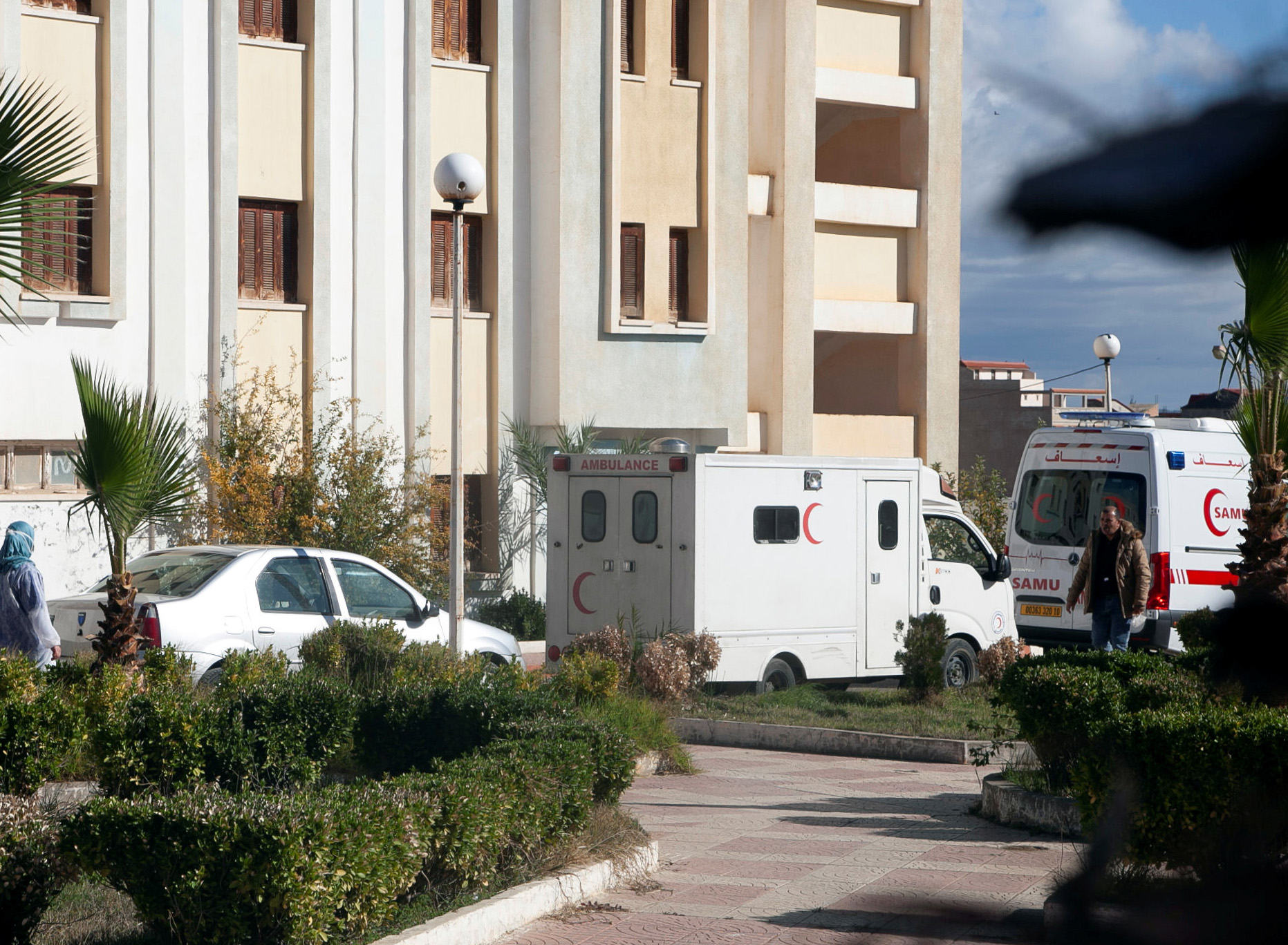 Ambulances park outside a university campus converted into a quarantine zone for patients suffering from the coronavirus disease (COVID-19), in the city of Bouira, Algeria December 6, 2020. Picture taken December 6, 2020. REUTERS
