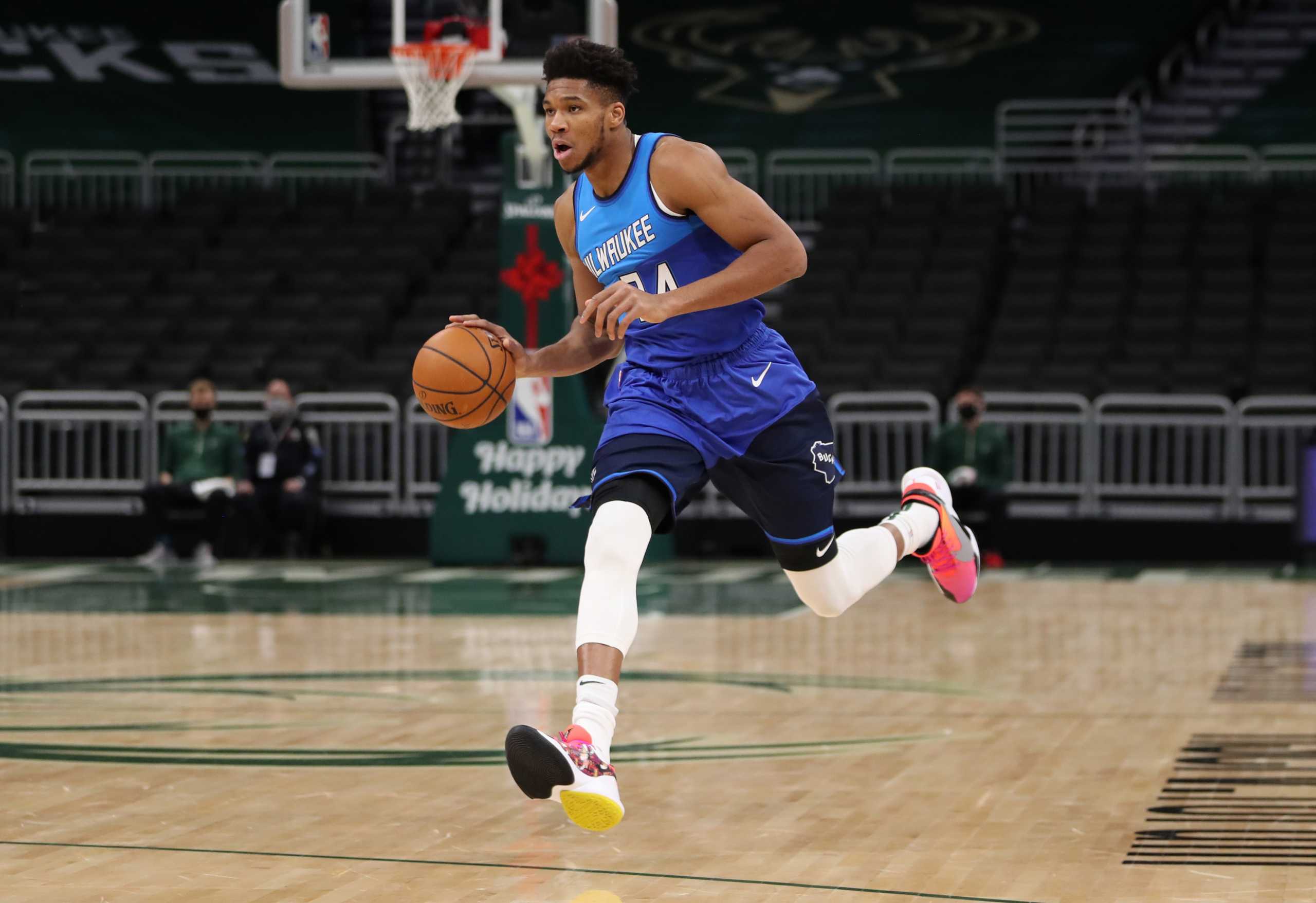Dec 25, 2020; Milwaukee, WI, USA; Milwaukee Bucks forward Giannis Antetokounmpo (34) brings the ball up court against the Golden State Warriors during a NBA game at the Bradley Center. Mandatory Credit: Nick Monroe