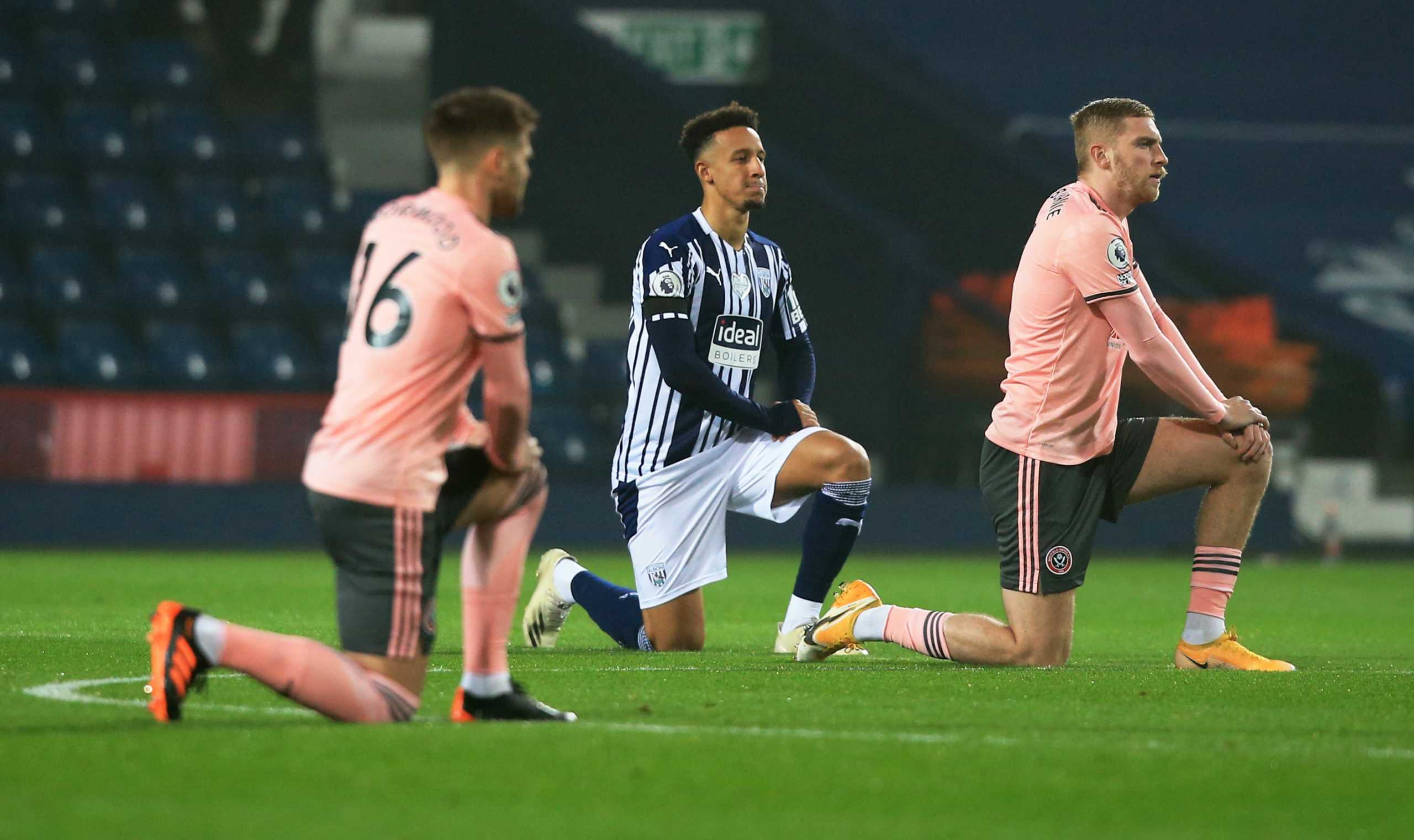 Soccer Football - Premier League - West Bromwich Albion v Sheffield United - The Hawthorns, West Bromwich, Britain - November 28, 2020 West Bromwich Albion's Callum Robinson takes a knee in support of the Black Lives Matter campaign before the match Pool via REUTERS