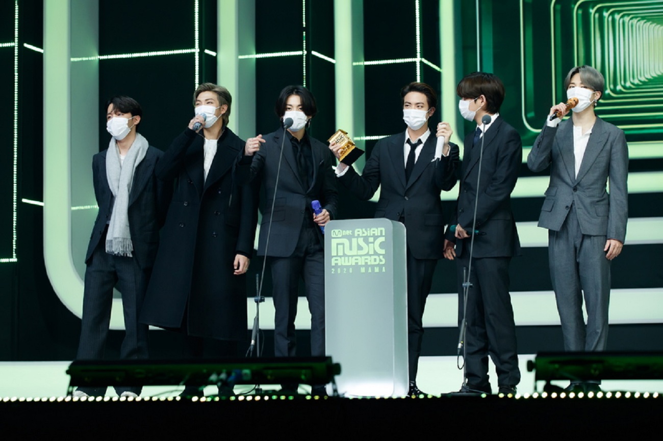 epa08867816 A handout photo made available by Mnet shows BTS members celebrating after winning eight top prizes at the 2020 Mnet Asian Music Awards (MAMA), the biggest K-pop music awards, in Paju, South Korea, 06 December 2020.  EPA
