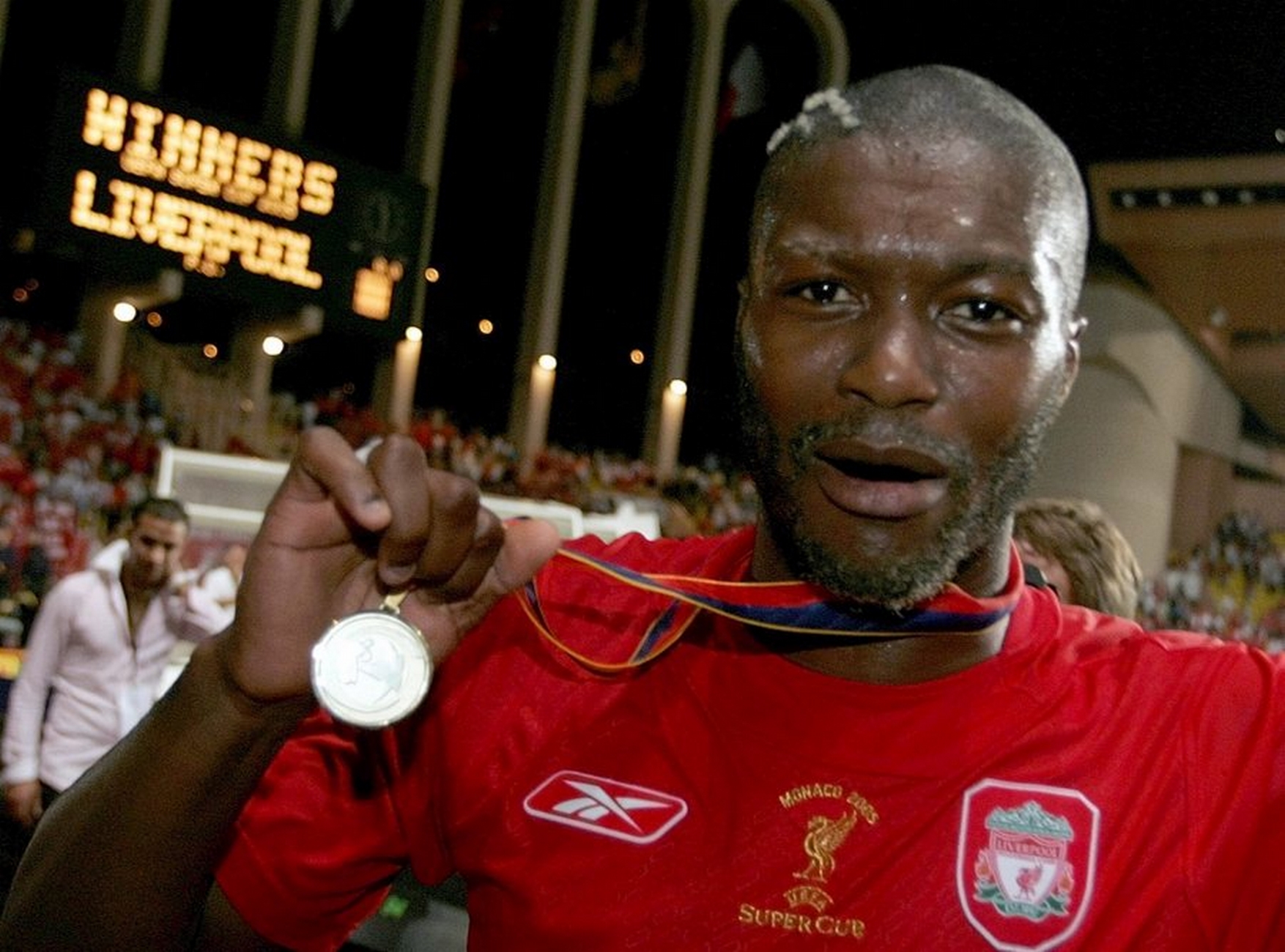 epa000511991 Djibril Cisse of Liverpool, the champions league winner, celebrates their victory in the UEFA Super Cup match against CSK Moscow, the UEFA cup winner, in Monaco, Friday, 26 August 2005.  EPA