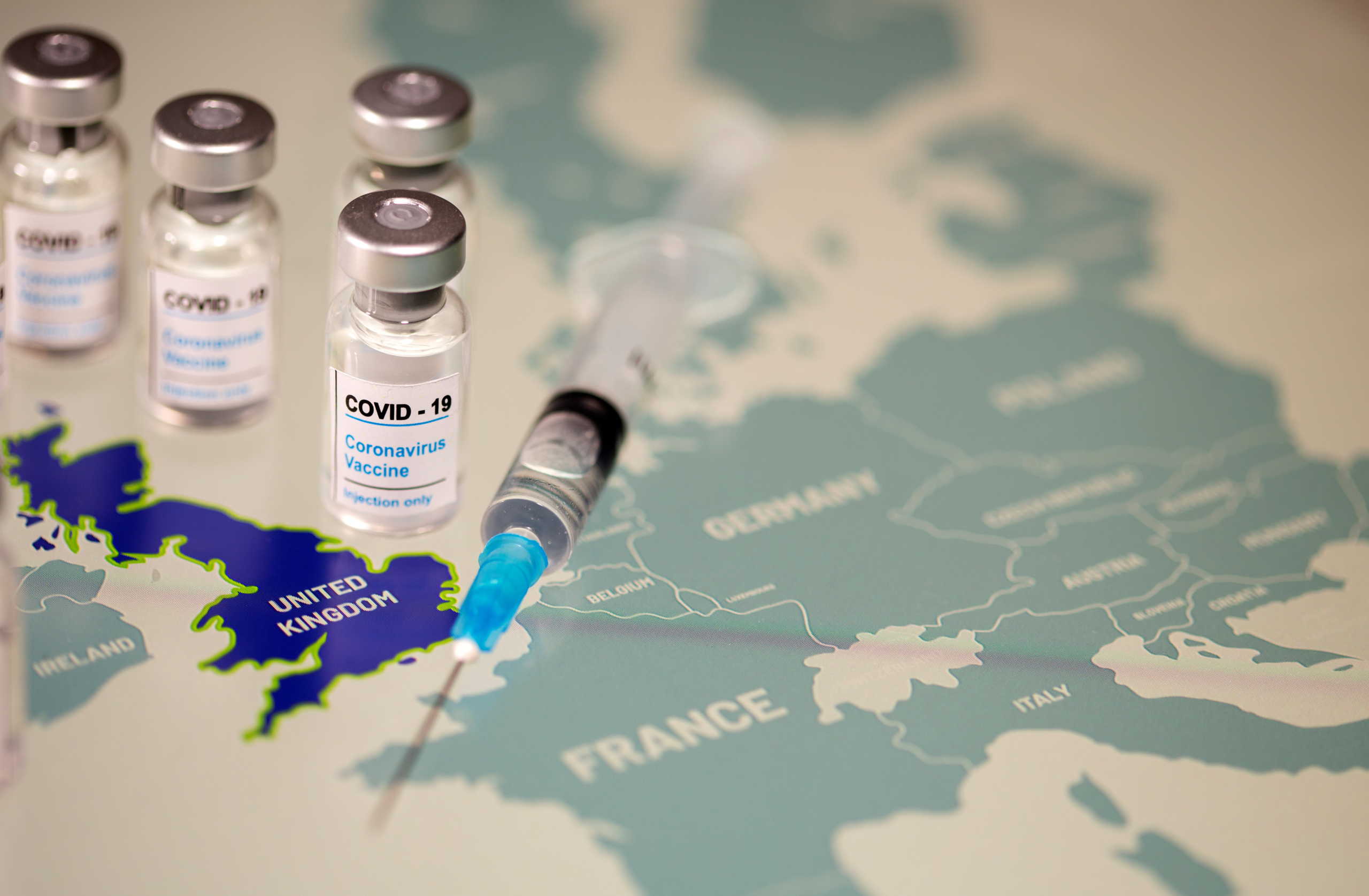 Vials labelled "COVID-19 Coronavirus-Vaccine" and medical syringe are placed on the European Union map in this picture illustration taken December 2, 2020. REUTERS