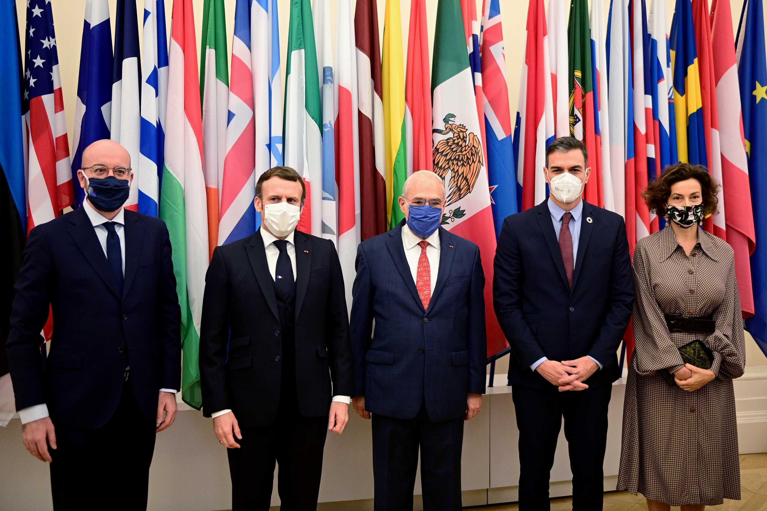FILE PHOTO: European Council President Charles Michel, French President Emmanuel Macron, OECD's Secretary General Angel Gurria, Spain's Prime Minister Pedro Sanchez and UNESCO Director-General Audrey Azoulay pose for a photo at their arrival for a ceremony marking the 60th anniversary of the creation of the Organisation for Economic Co-operation and Development (OECD), at its headquarters in Paris, France December 14, 2020.  Martin Bureau