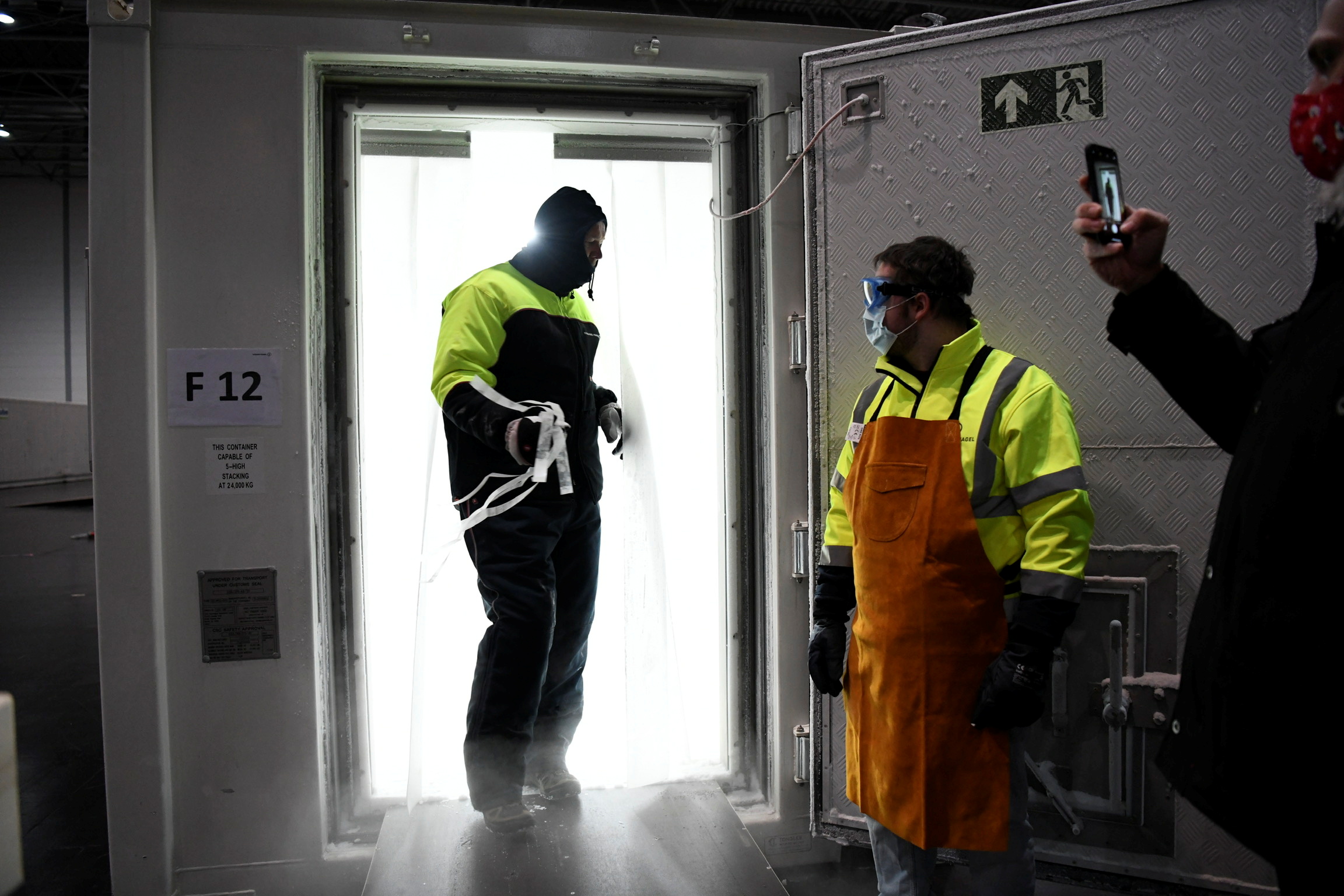 Employees at work during the arrival of Pfizer-BioNtech COVID-19 vaccine at an undisclosed location in North Rhine Westphalia, Germany December 26, 2020, one day before the country starts its vaccination programme.  Mark Hermenau
