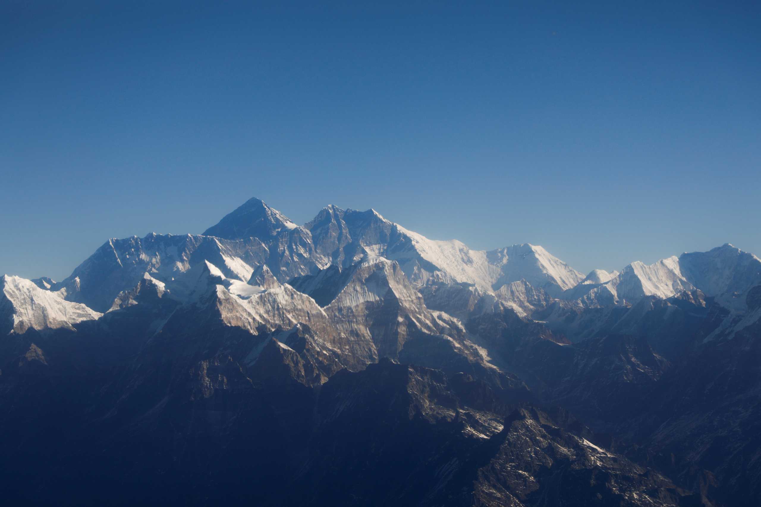 FILE PHOTO: Mount Everest, the world highest peak, and other peaks of the Himalayan range are seen through an aircraft window during a mountain flight from Kathmandu, Nepal January 15, 2020. REUTERS