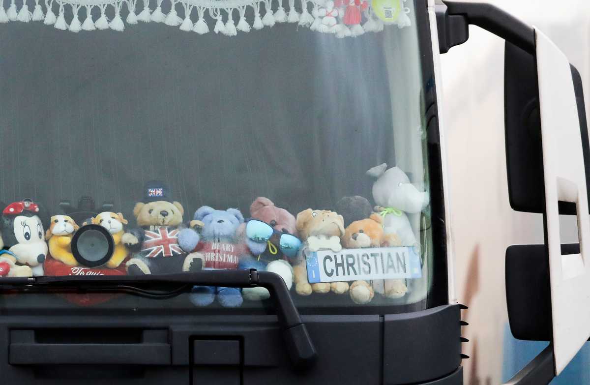 Teddy bears including one with the a Union Jack flag are seen through the front window of a lorry at Ashford International Truck Stop, as EU countries impose a travel ban from the UK following the coronavirus disease (COVID-19) outbreak, in Ashford, Britain December 22, 2020. REUTERS