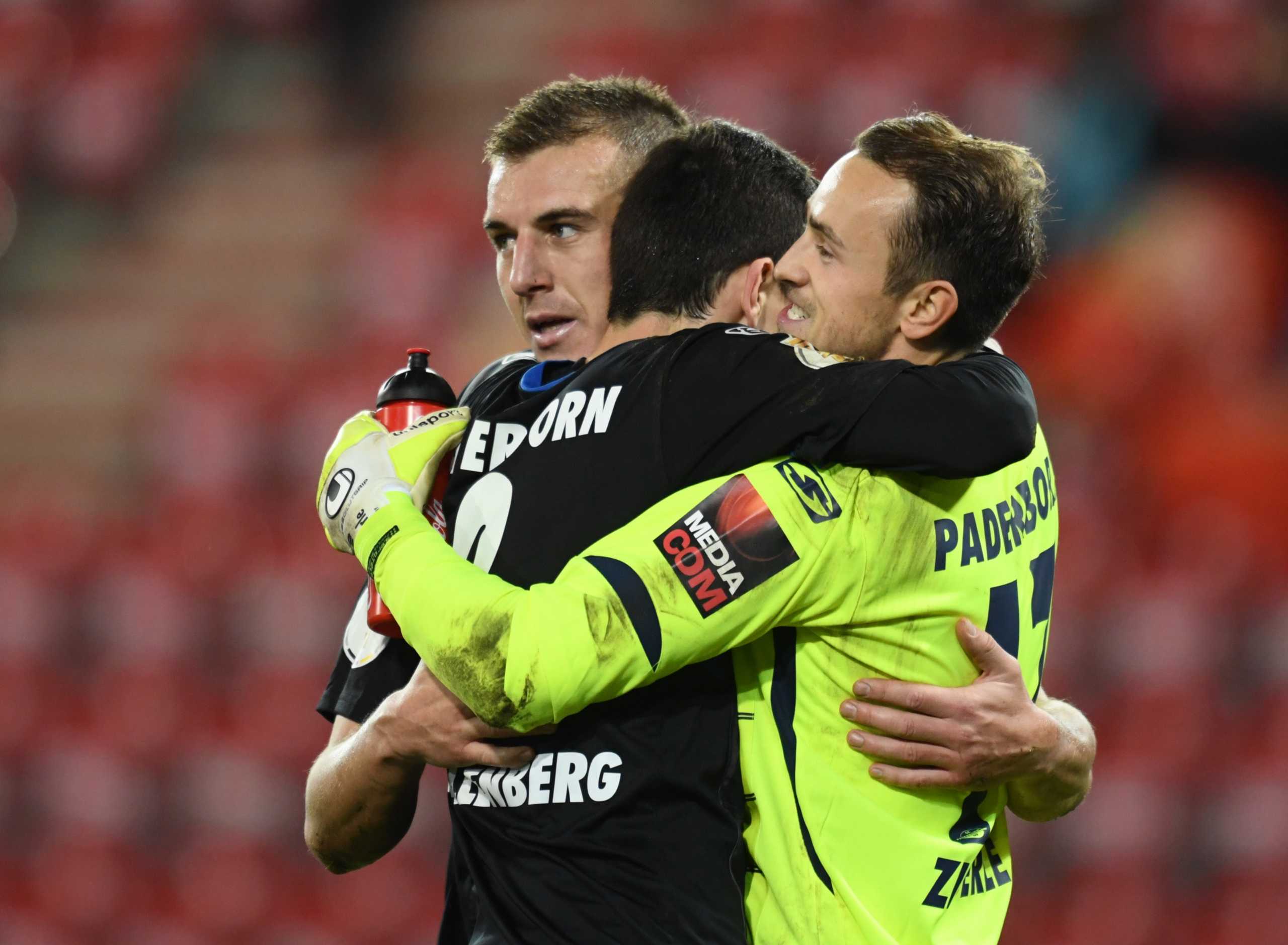 Soccer Football - DFB Cup - Second Round - 1. FC Union Berlin v SC Paderborn - Stadion An der Alten Forsterei, Berlin, Germany - December 22, 2020 SC Paderborn's Uwe Hunemeier and Leopold Zingerle celebrates after the match REUTERS