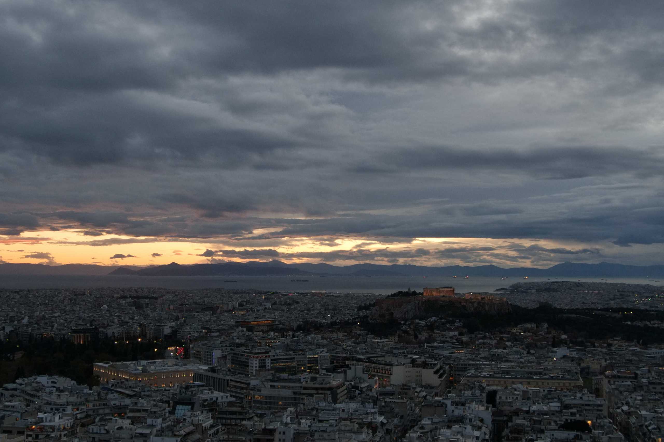 The Parthenon temple is seen atop the Acropolis hill at dusk, in Athens, Greece, December 10, 2020. REUTERS