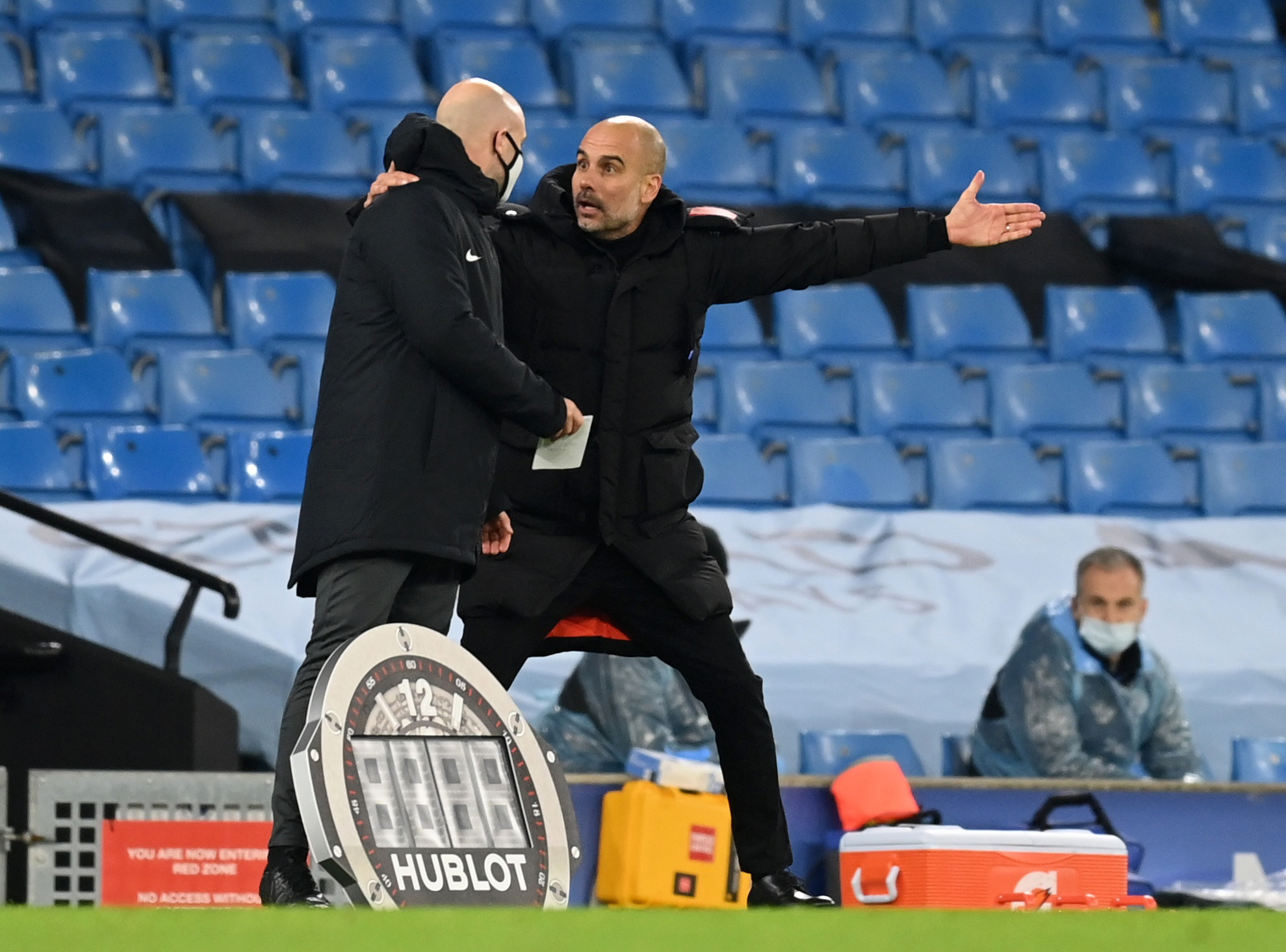 Soccer Football - Premier League - Manchester City v West Bromwich Albion - Etihad Stadium, Manchester, Britain - December 15, 2020 Manchester City manager Pep Guardiola remonstrates with the fourth official Pool via REUTERS