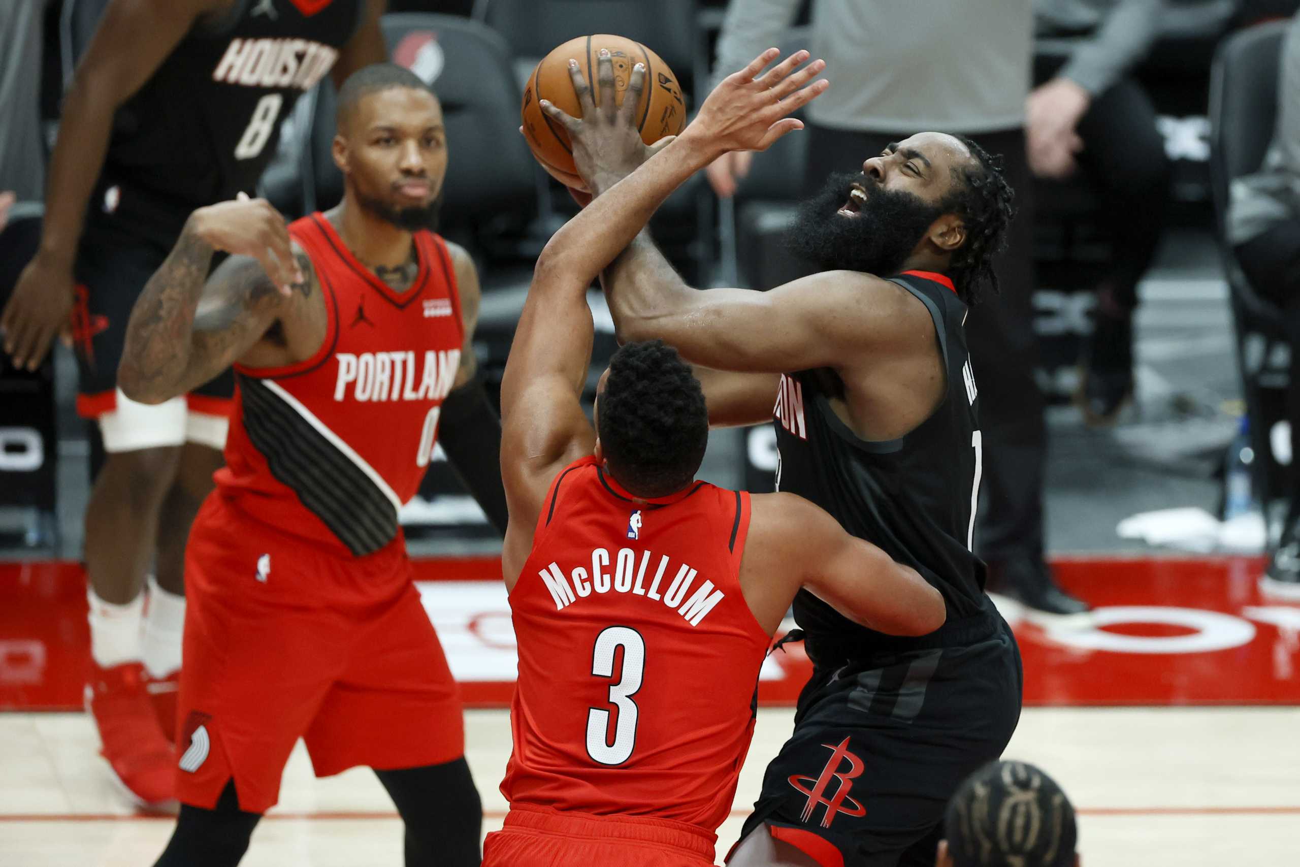 Dec 26, 2020; Portland, Oregon, USA; Houston Rockets shooting guard James Harden (13) is fouled while shooting by Portland Trail Blazers shooting guard CJ McCollum (3) during the second half at Moda Center. Mandatory Credit: Soobum Im-USA TODAY Sports