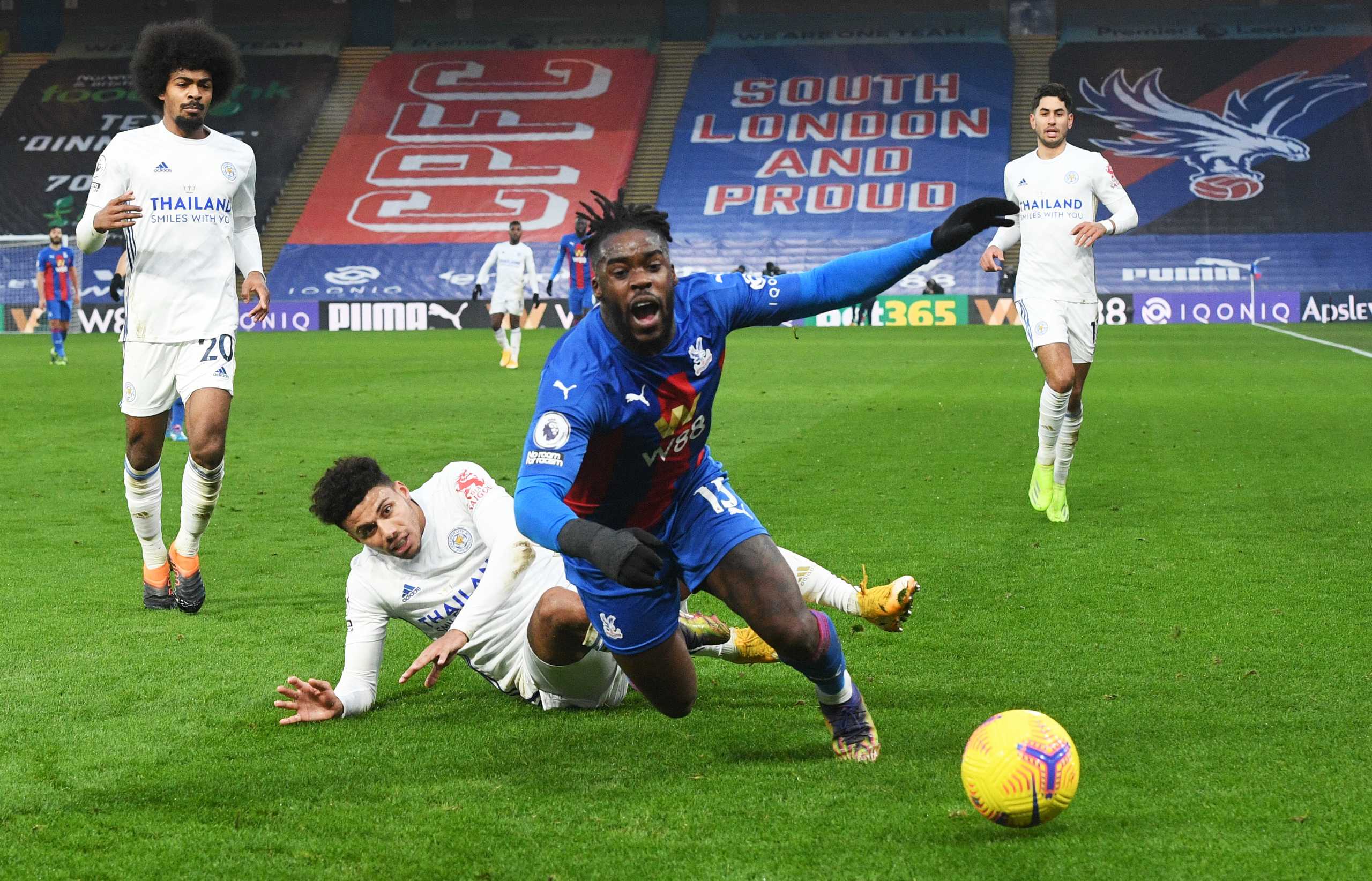 Soccer Football - Premier League - Crystal Palace v Leicester City - Selhurst Park, London, Britain - December 28, 2020 Leicester City's James Justin in action with Crystal Palace's Jeffrey Schlupp Pool via REUTERS