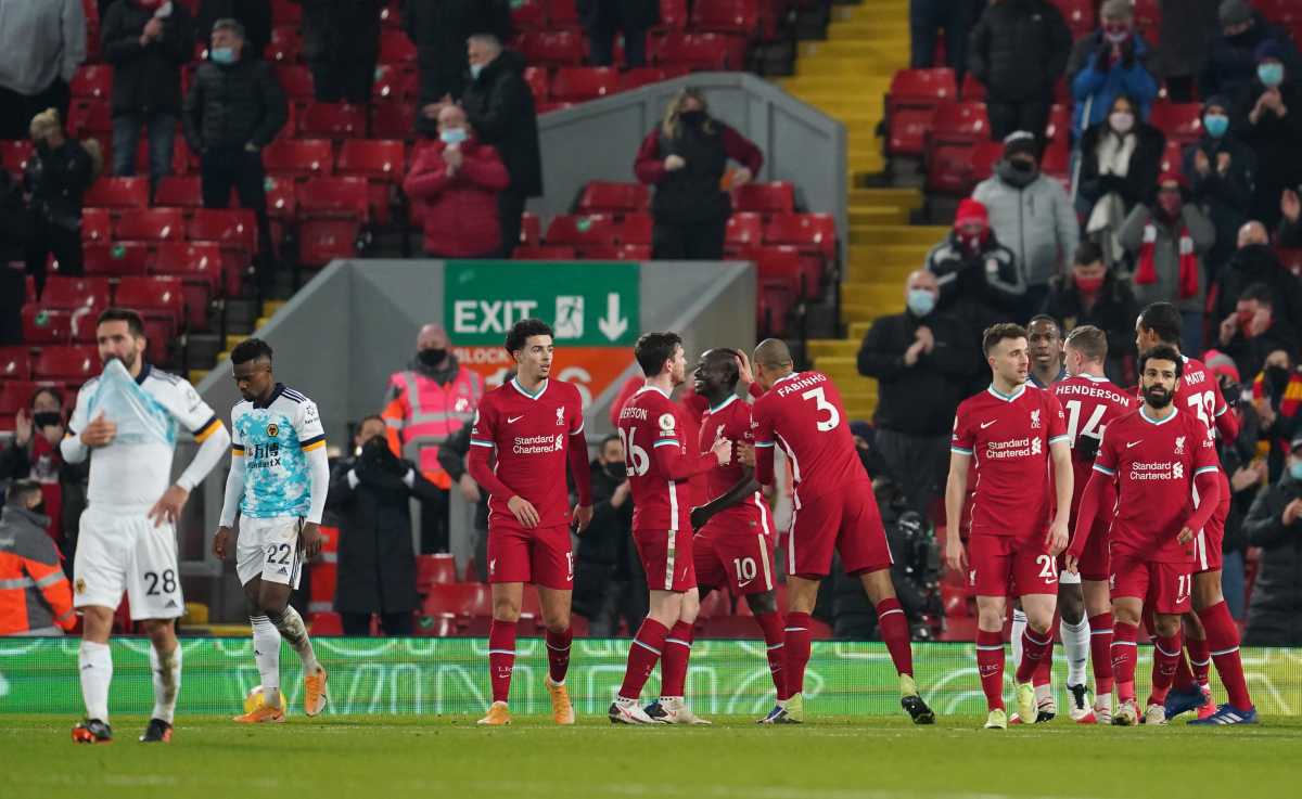 Soccer Football - Premier League - Liverpool v Wolverhampton Wanderers - Anfield, Liverpool, Britain - December 6, 2020 Liverpool players celebrate after Wolverhampton Wanderers' Nelson Semedo scores an own goal and Liverpool's fourth Pool via REUTERS