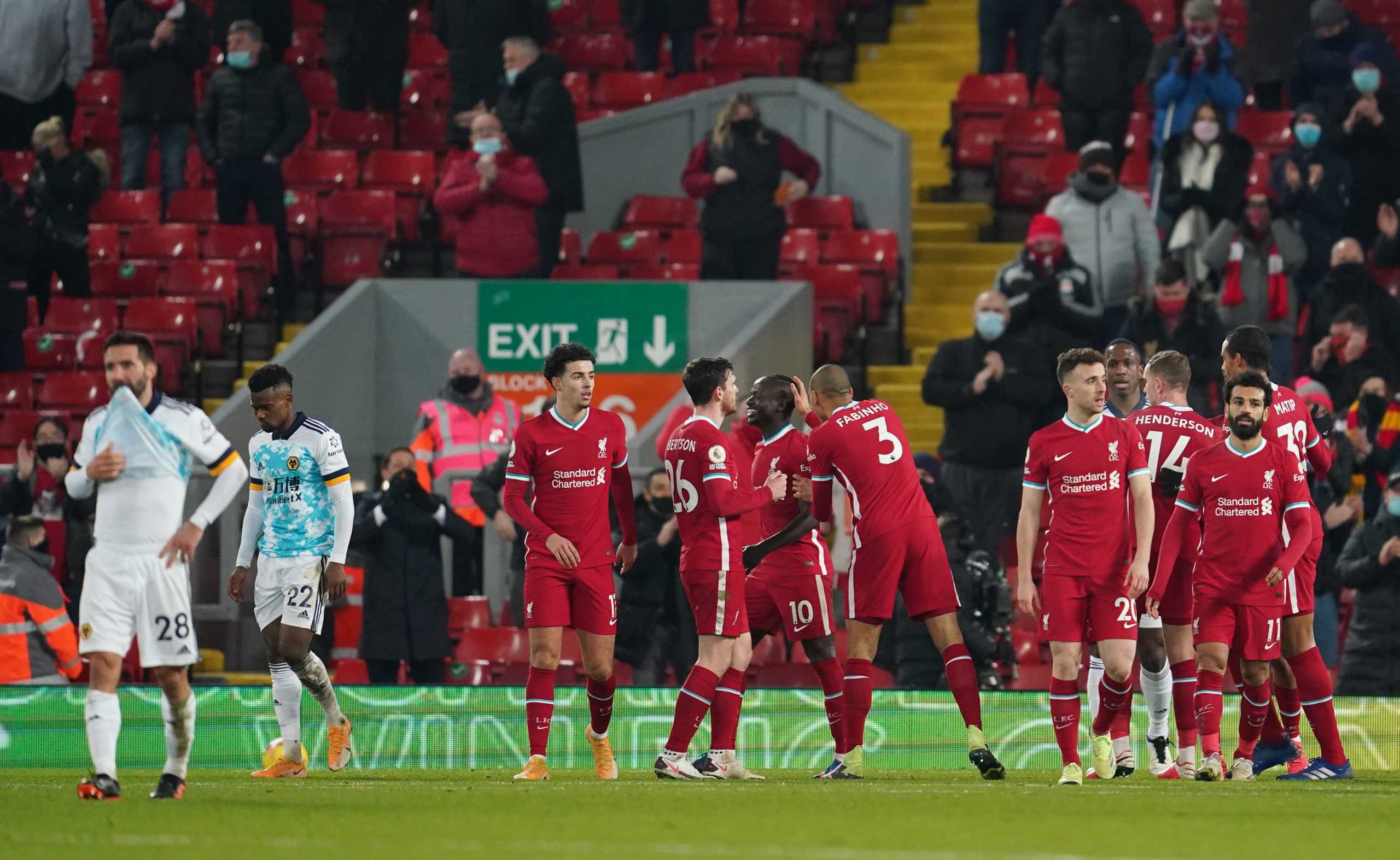 Soccer Football - Premier League - Liverpool v Wolverhampton Wanderers - Anfield, Liverpool, Britain - December 6, 2020 Liverpool players celebrate after Wolverhampton Wanderers' Nelson Semedo scores an own goal and Liverpool's fourth Pool via REUTERS