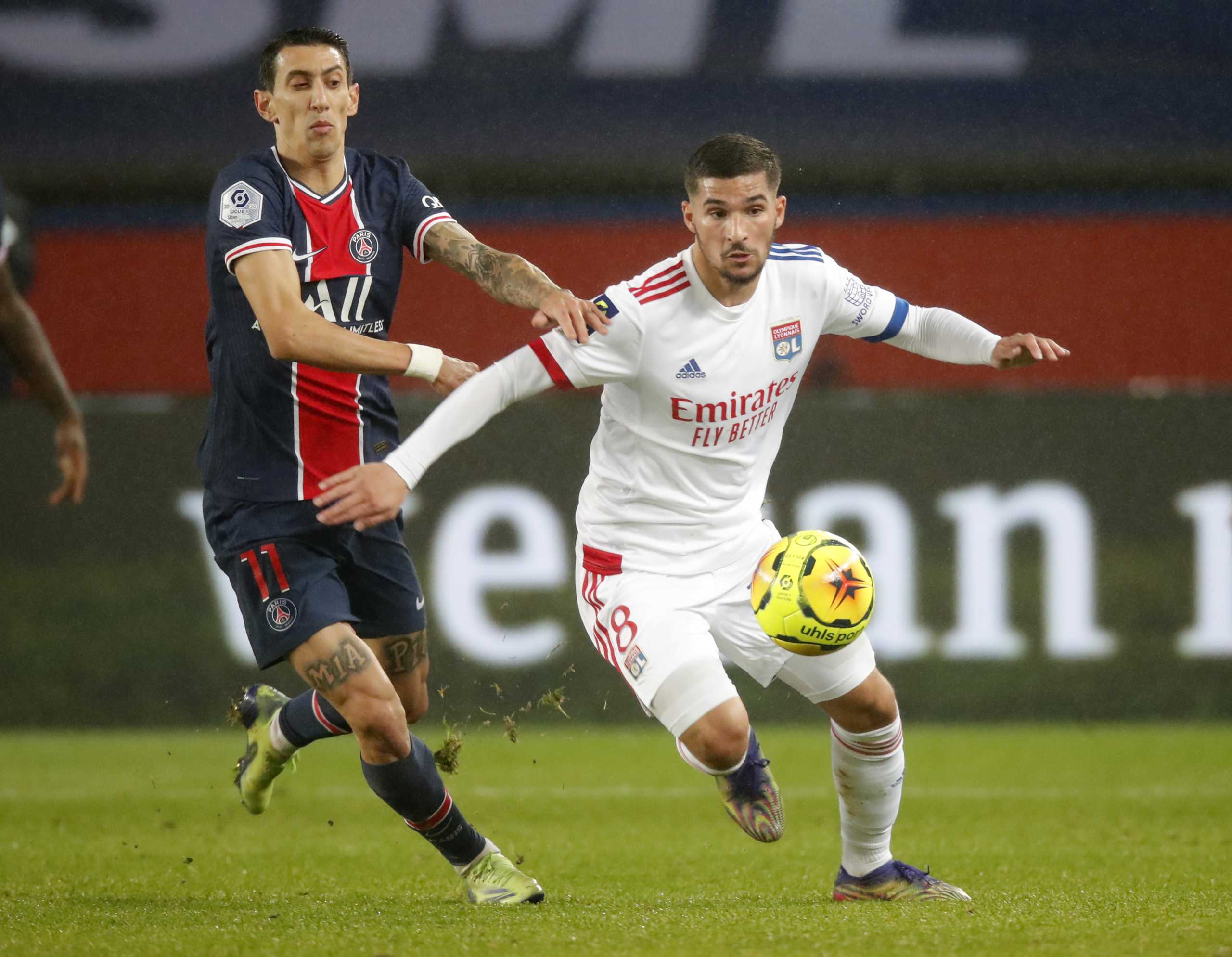 Soccer Football - Ligue 1 - Paris St Germain v Olympique Lyonnais - Parc des Princes, Paris, France - December 13, 2020 Olympique Lyonnais' Houssem Aouar in action with Paris St Germain's Angel Di María REUTERS