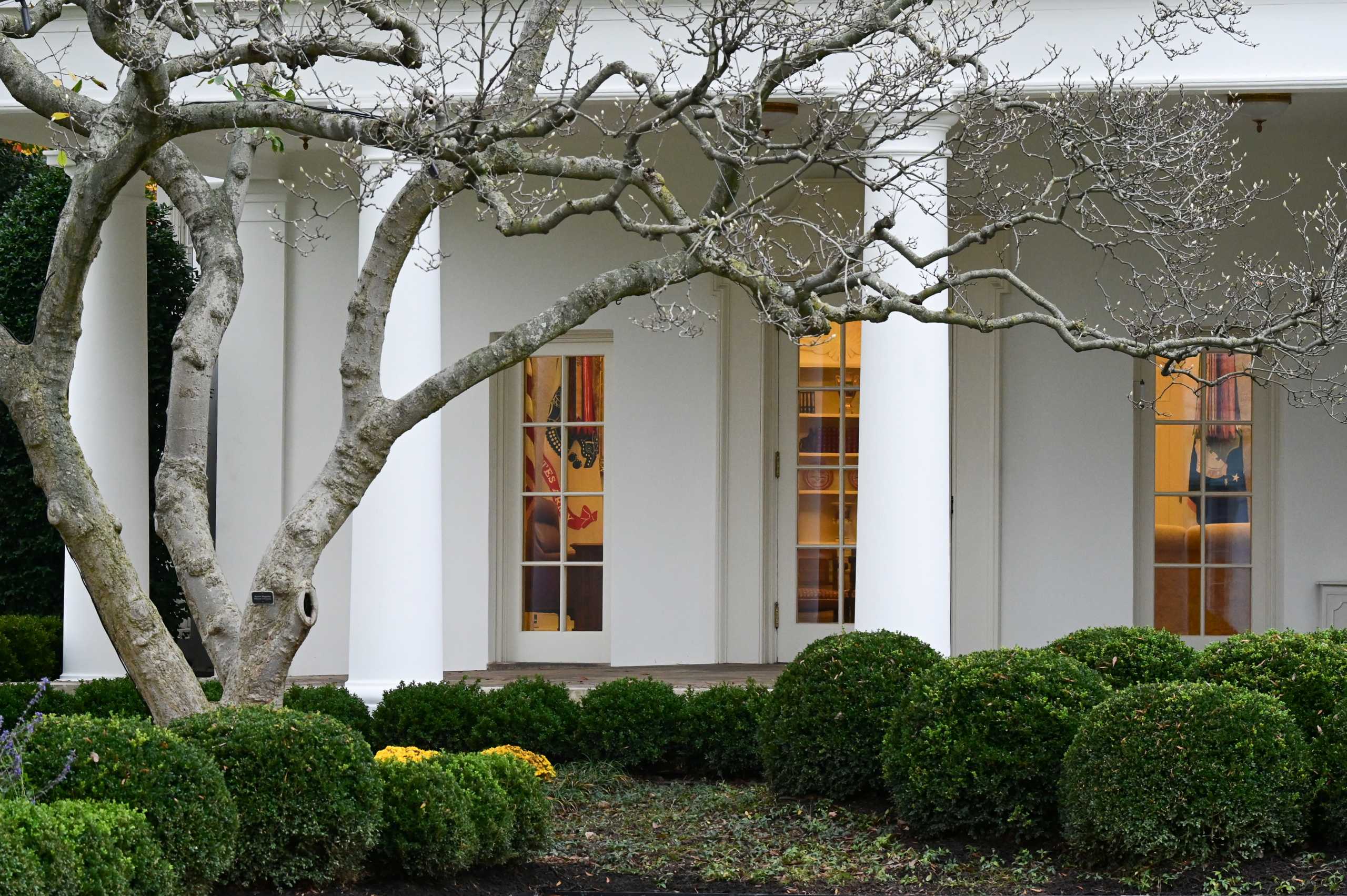 The Oval Office and Resolute Desk are seen empty with the lights on upon U.S. President Donald Trump's return to the White House after golfing, in Washington, U.S. November 22, 2020. REUTERS