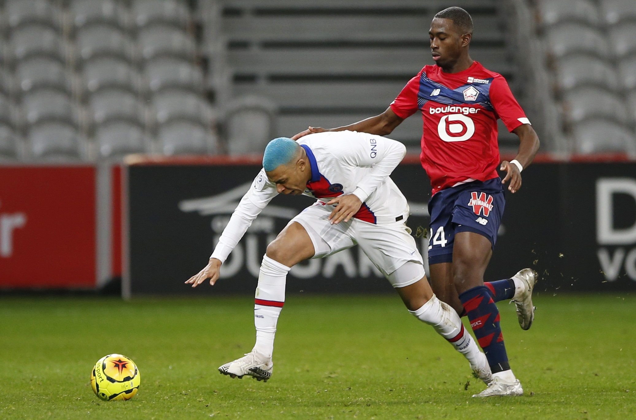 Soccer Football - Ligue 1 - Lille v Paris St Germain - Stade Pierre-Mauroy, Lille, France - December 20, 2020 Lille's Boubakary Soumare in action with Paris St Germain's Kylian Mbappe REUTERS