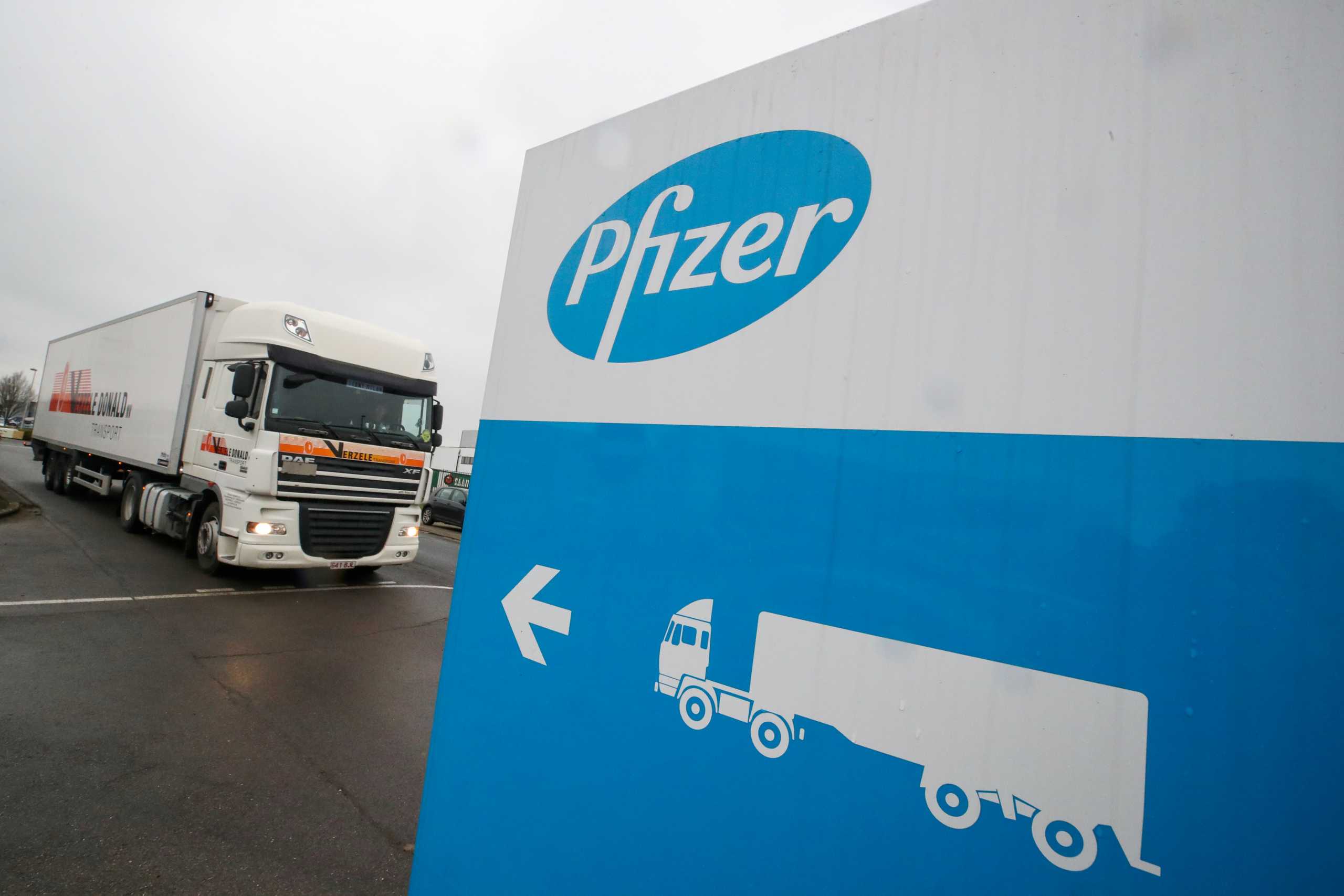 FILE PHOTO: A refrigerated truck leaves the Pfizer plant in Puurs, Belgium December 3, 2020. REUTERS