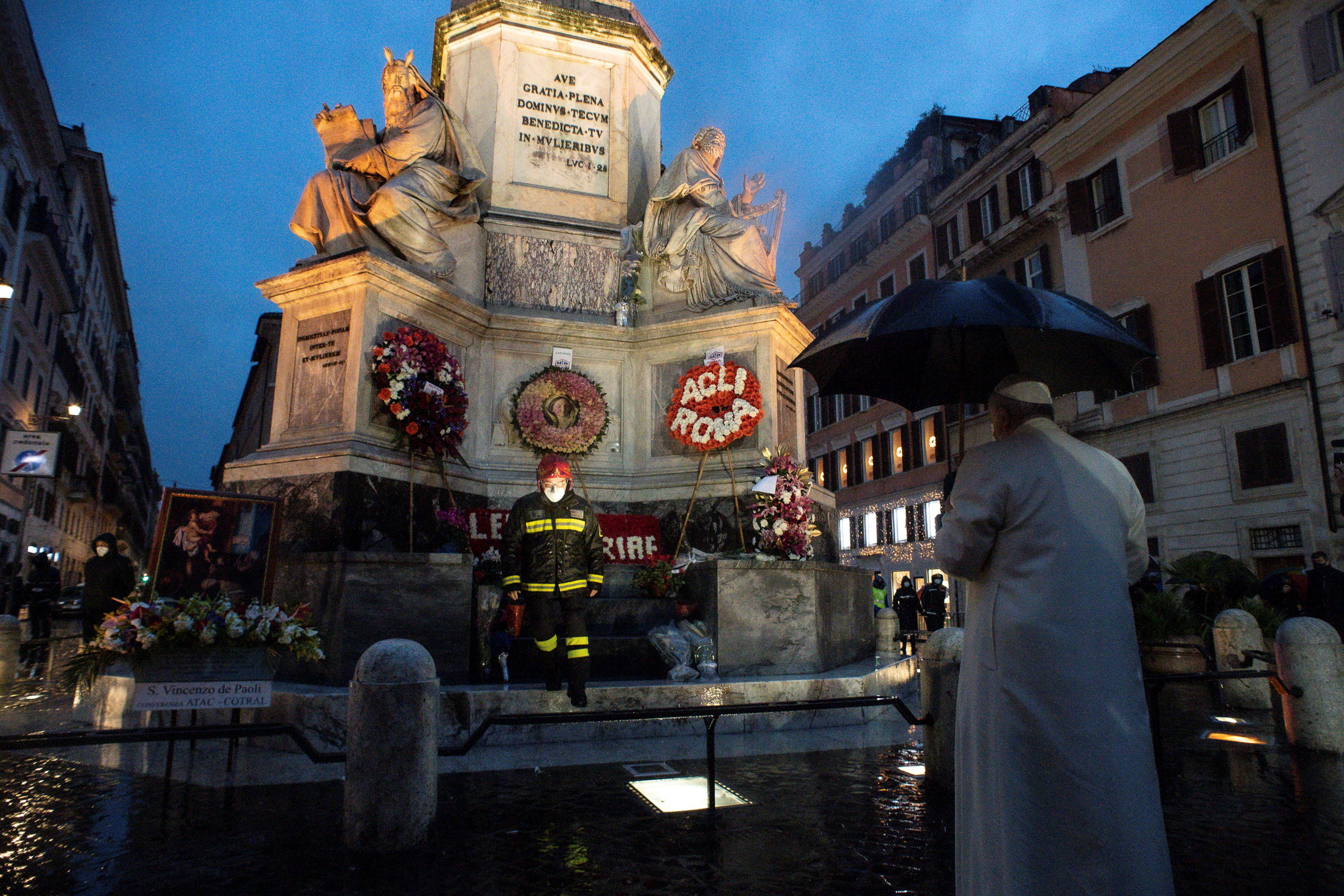 Pope Francis makes a pre-dawn visit to the statue of Madonna near the Spanish Steps on the feast of the Immaculate Conception, an event that would usually held during the day with crowds of people but was instead made privately due to the coronavirus disease (COVID-19) outbreak, in Rome, Italy, December 8, 2020. Vatican Media