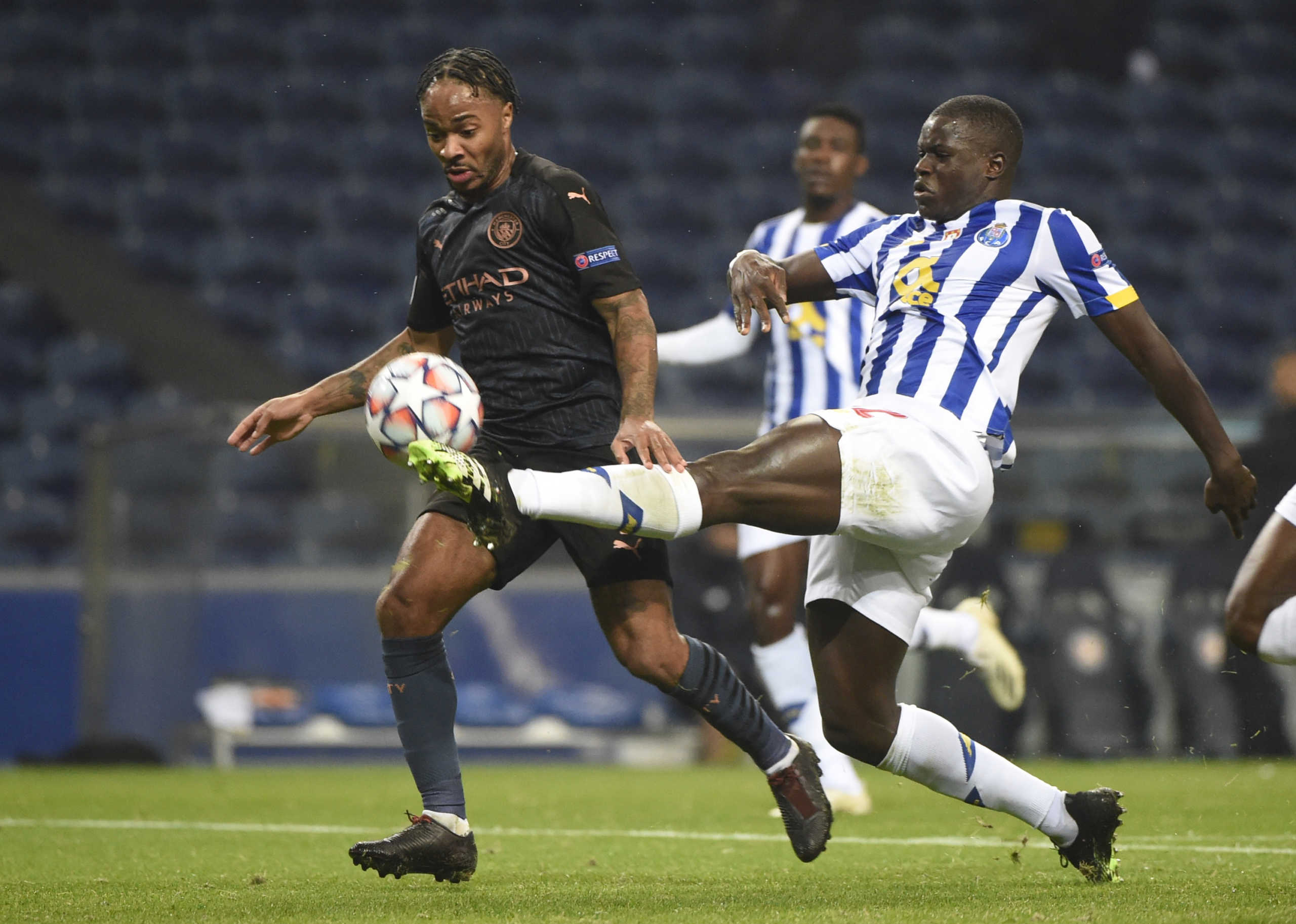 Soccer Football - Champions League - Group C - FC Porto v Manchester City - Estadio do Dragao, Porto, Portugal - December 1, 2020   Manchester City's Raheem Sterling in action with FC Porto's Malang Sarr Pool via REUTERS