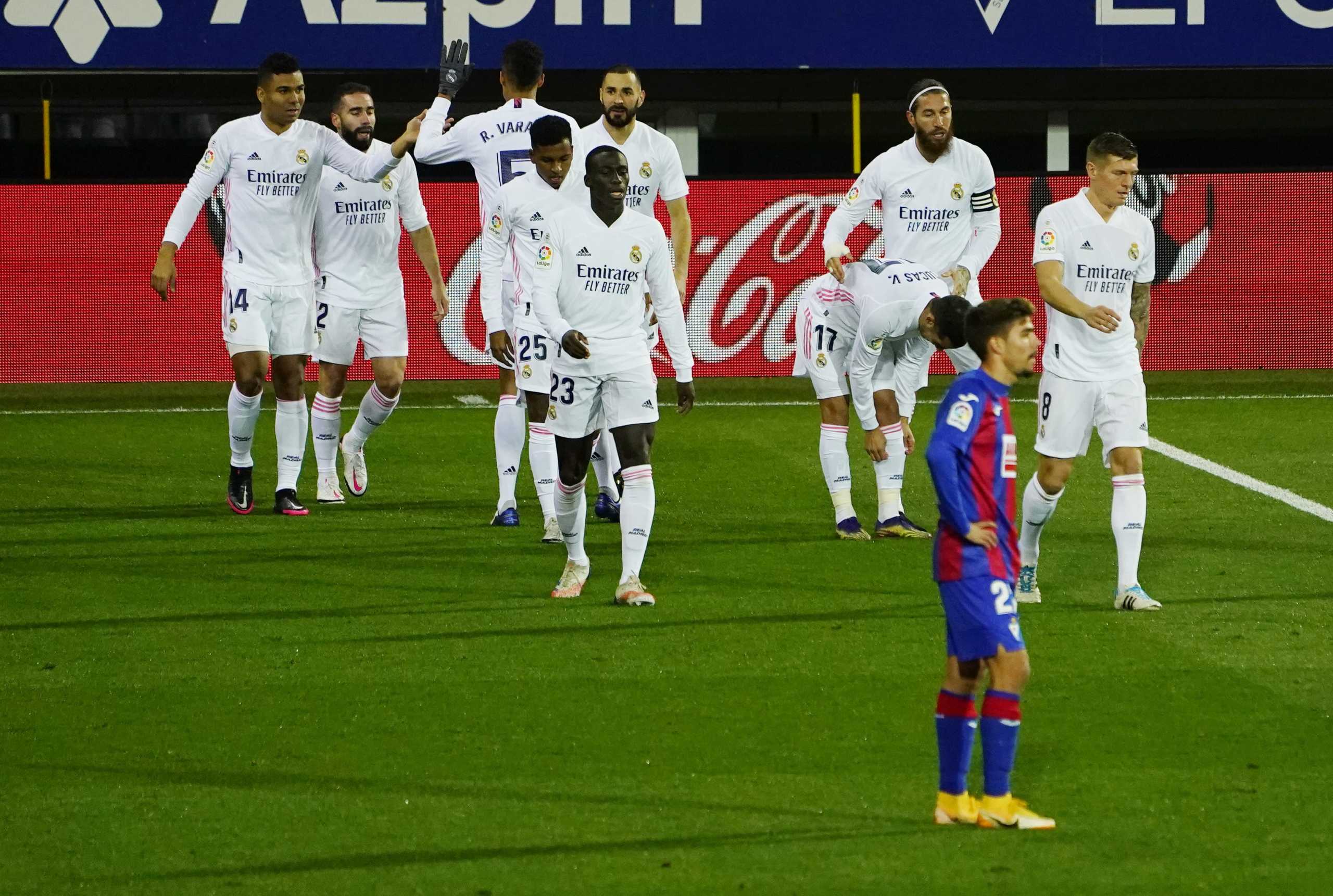 Soccer Football - La Liga Santander - Eibar v Real Madrid - Ipurua Municipal Stadium, Eibar, Spain - December 20, 2020 Real Madrid's Karim Benzema celebrates scoring their first goal with teammates REUTERS