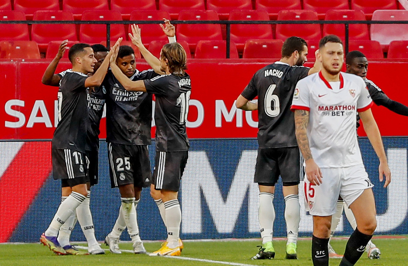 Soccer Football - La Liga Santander - Sevilla v Real Madrid - Ramon Sanchez Pizjuan, Seville, Spain - December 5, 2020 Real Madrid players celebrate scoring their first goal Pool via REUTERS