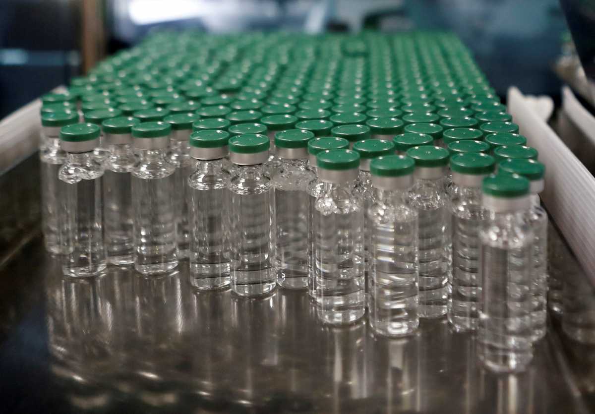 FILE PHOTO: Vials of AstraZeneca's COVISHIELD, coronavirus disease (COVID-19) vaccine are seen before they are packaged inside a lab at Serum Institute of India, in Pune, India, November 30, 2020.  REUTERS