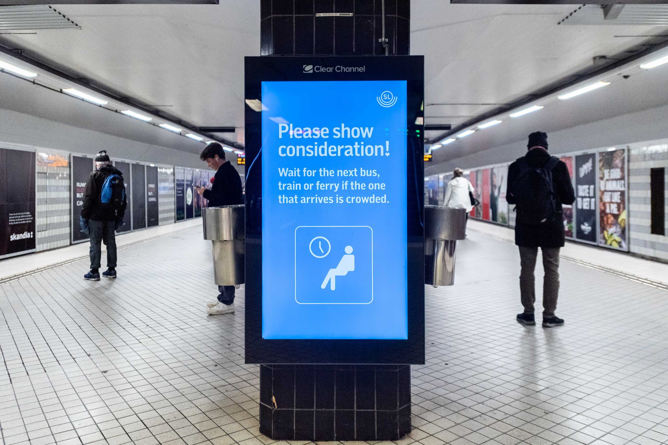 A sign requesting commuters to show consideration amid the continuous spread of the coronavirus disease (COVID-19) pandemic is pictured at Stockholm Central metro station, in Stockholm, Sweden, November 19, 2020.   TT News Agency