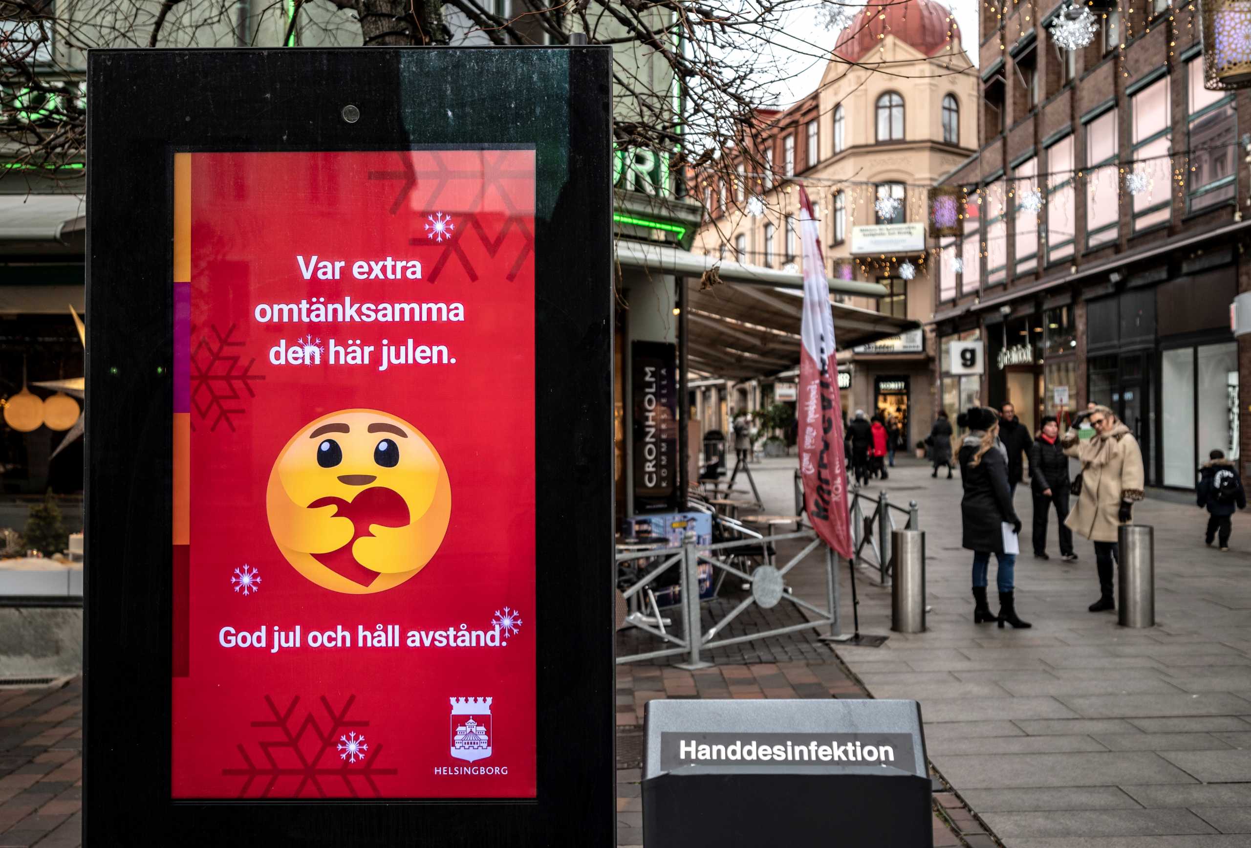 An information sign wishing Merry Christmas and asking to maintain social distancing is seen at a pedestrian shopping street amid the spread of the coronavirus disease (COVID-19) in Helsingborg, Sweden, December 7, 2020. Johan Nilsson