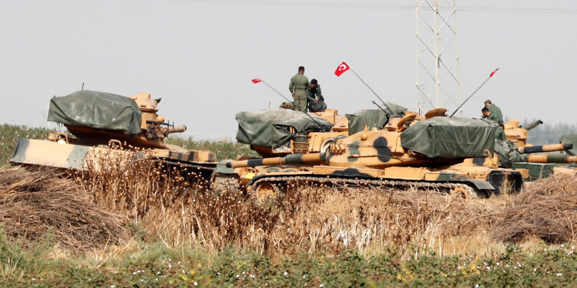 Turkish soldiers stand on top of tanks near the Turkish-Syrian border in Sanliurfa province, Turkey, October 15, 2019. REUTERS