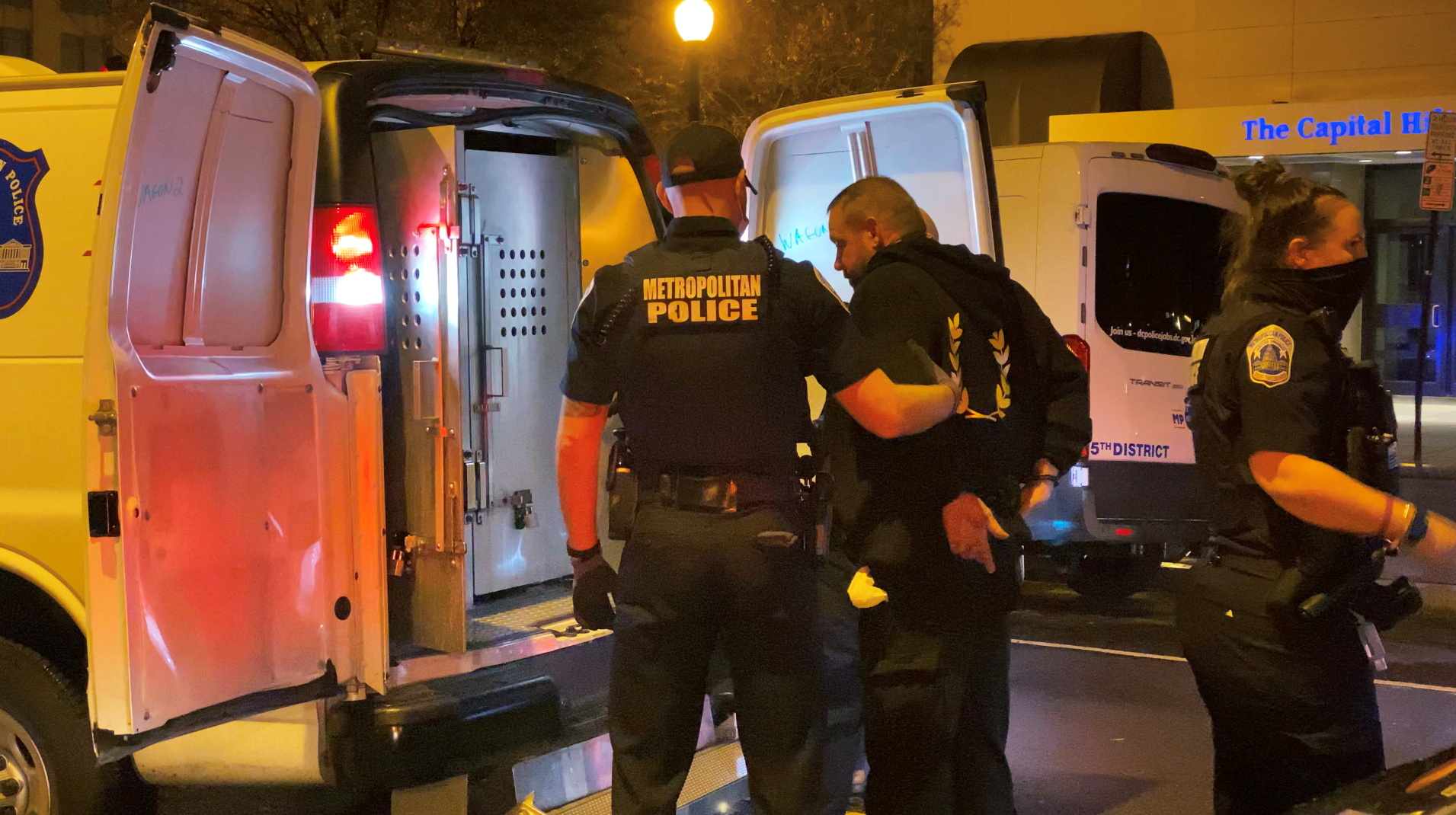 A member of the far-right group Proud Boys is detained by law enforcement at a march protesting the results of the election, in Washington, U.S., December 12, 2020, in this still image obtained from a social media video.  BRENDAN GUTENSCHWAGER