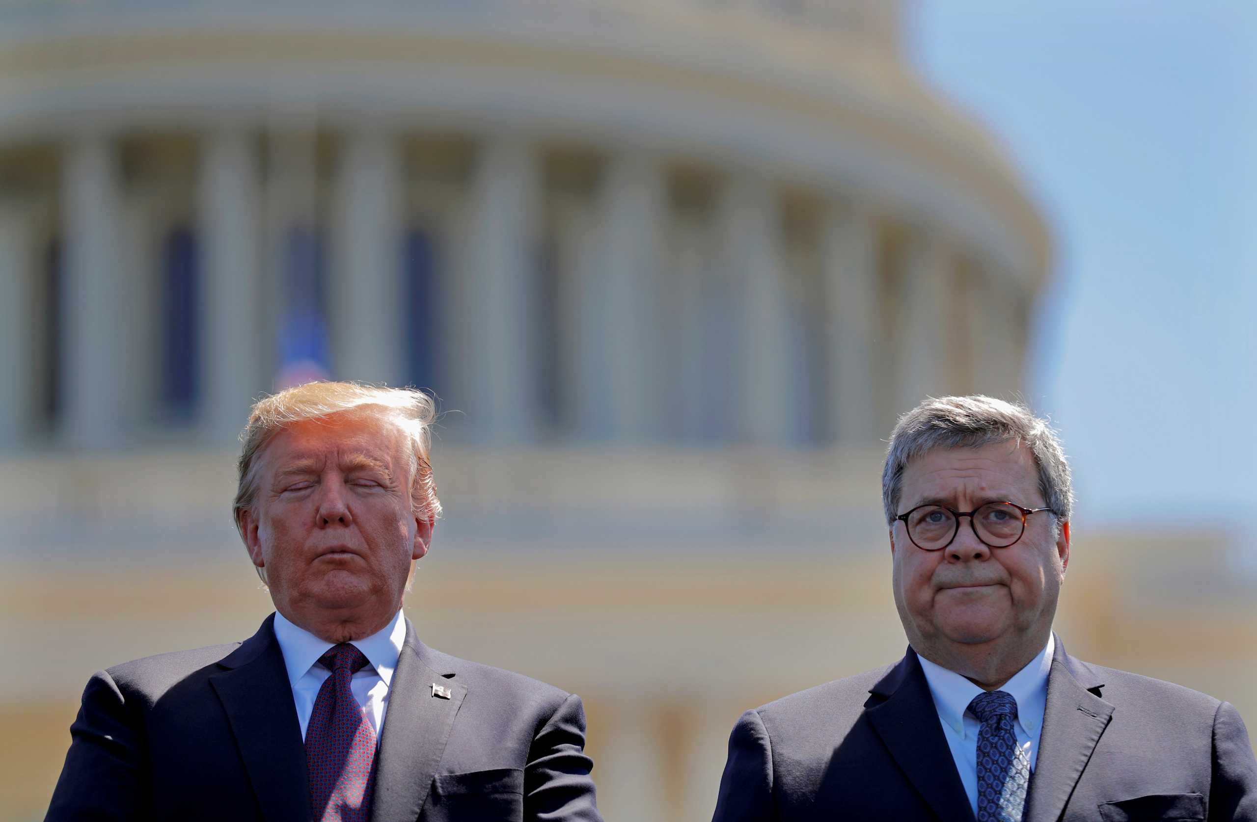 FILE PHOTO: U.S. President Donald Trump and U.S. Attorney General William Barr attend the 38th Annual National Peace Officers Memorial Service on Capitol Hill in Washington, U.S., May 15, 2019. REUTERS