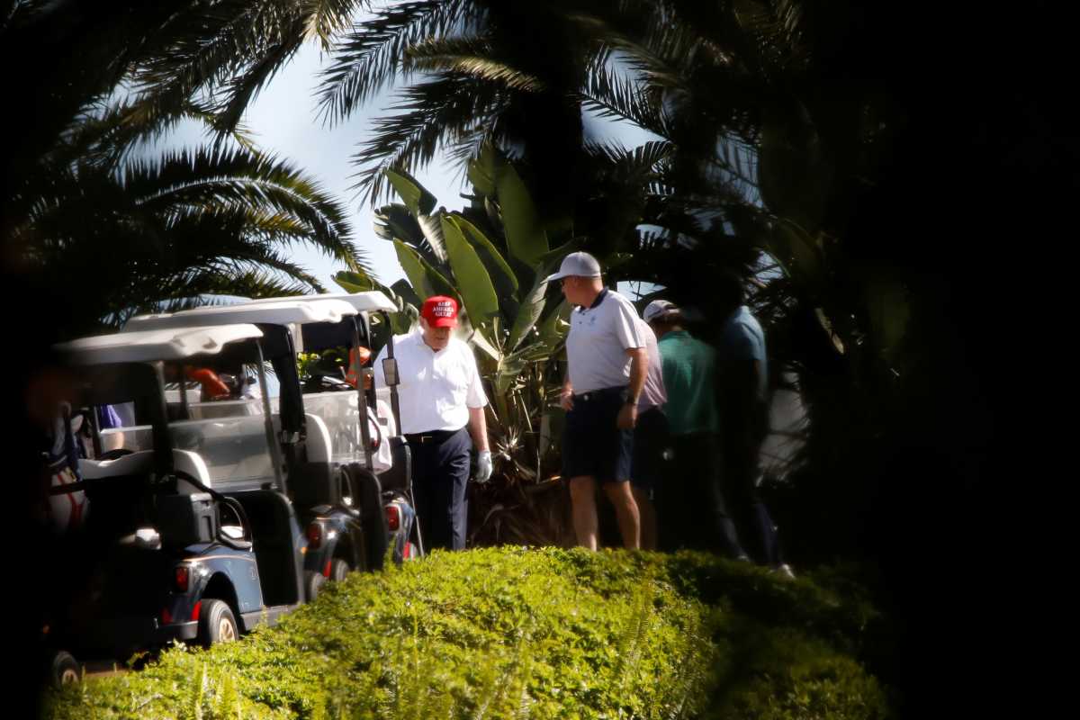U.S. President Donald Trump plays golf at the Trump International Golf Club in West Palm Beach, Florida, U.S., December 27, 2020. REUTERS