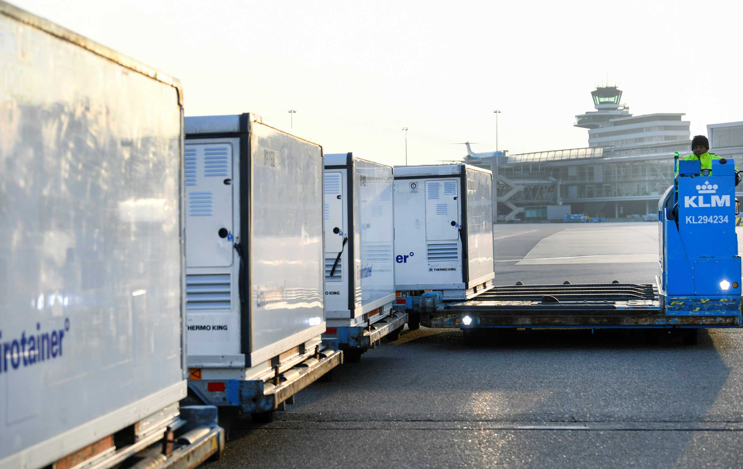 Cool boxes are being transported at the Schiphol Airport as Air France-KLM's cargo operations are preparing a massive logistical operation carrying new vaccines and vaccine candidates for COVID-19 through Amsterdam's Schiphol Airport, Netherlands November 25, 2020. Picture taken November 25, 2020. REUTERS