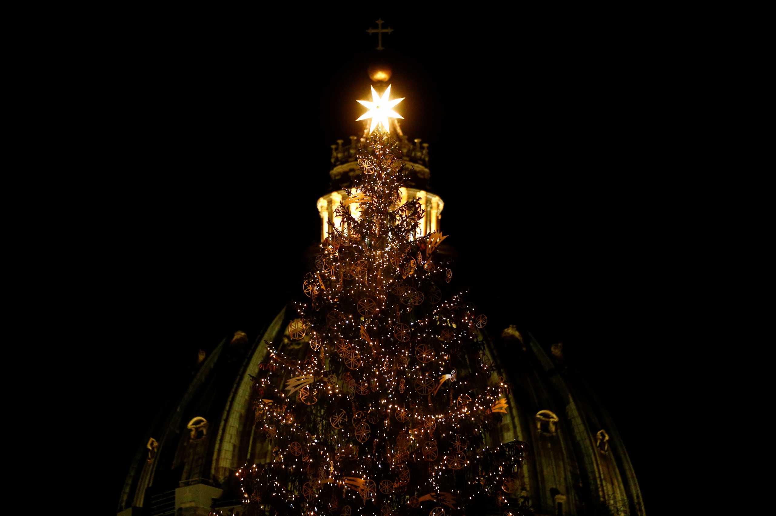 The Vatican Christmas tree is seen lit in St. Peter's Square, at the Vatican, December 11, 2020. REUTERS