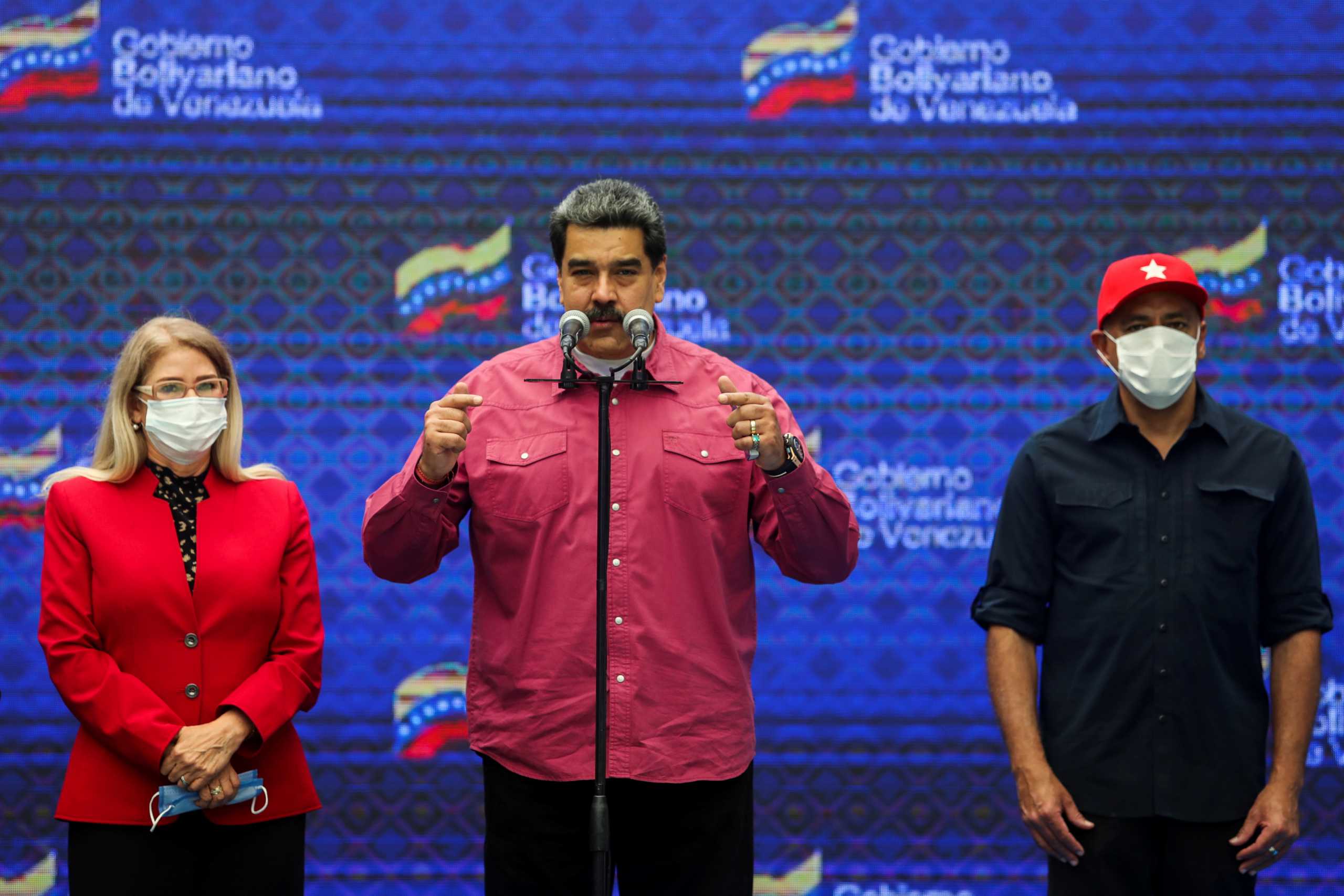 Venezuela's President Nicolas Maduro speaks to the media next to parliamentary candidates, his wife Cilia Flores and Jorge Rodriguez, after voting during the parliamentary election, in Caracas, Venezuela December 6, 2020. REUTERS