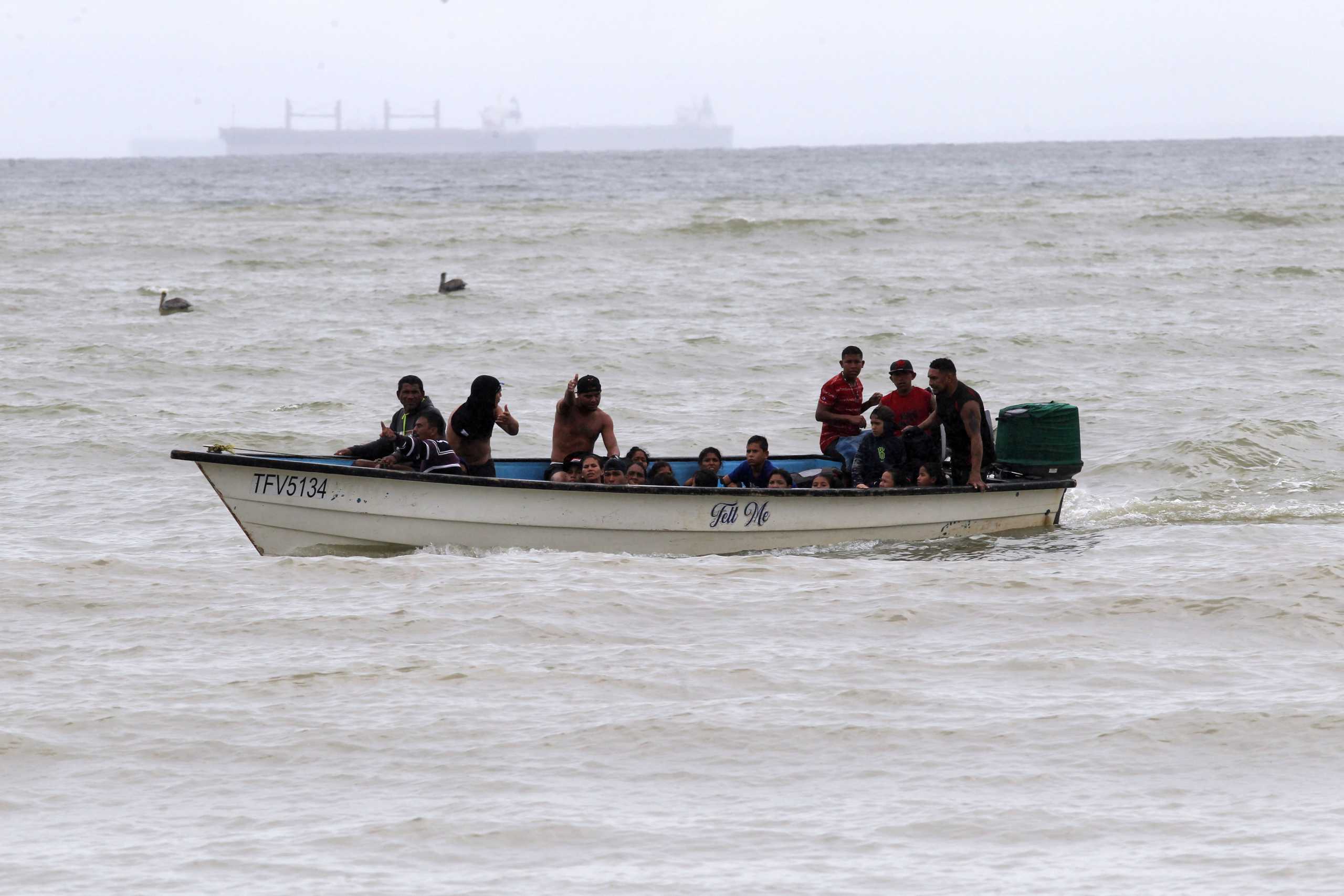 Venezuelan migrants, who were recently deported, arrive at shore on Los Iros Beach after their return to the island, in Erin, Trinidad and Tobago, November 24, 2020. Lincoln Holder