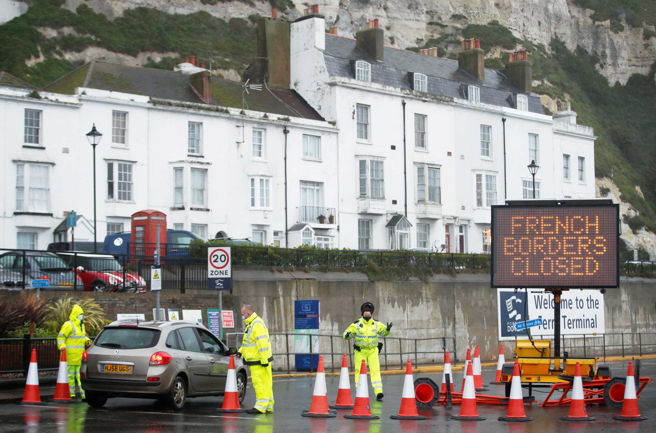 Security officers stand guard at an entrance of the Port of Dover as EU countries impose a travel ban from the UK following the coronavirus disease (COVID-19) outbreak, in Dover, Britain, December 21, 2020. REUTERS