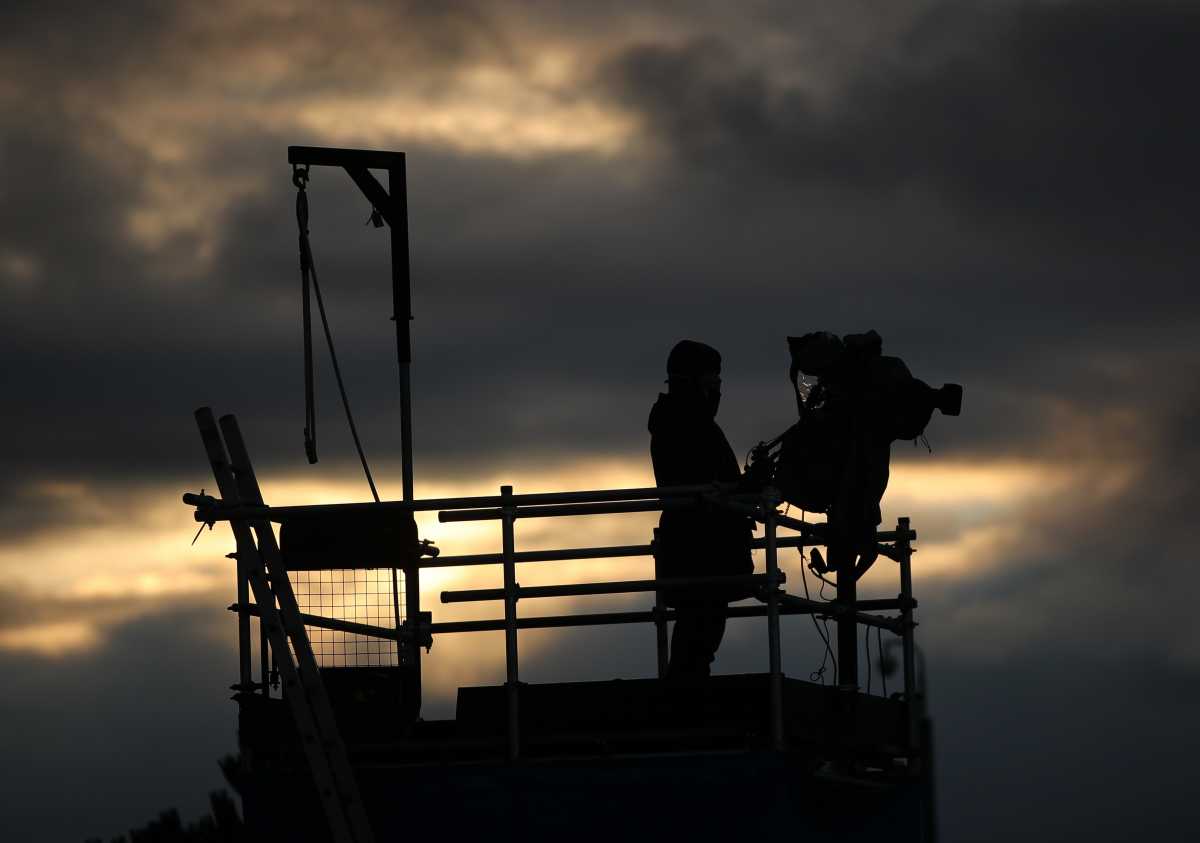 Soccer Football - Women's Super League - Everton v Manchester City - Walton Hall Park, Liverpool, Britain - December 6, 2020 A silhouette of a camera operator during the match Action Images via Reuters
