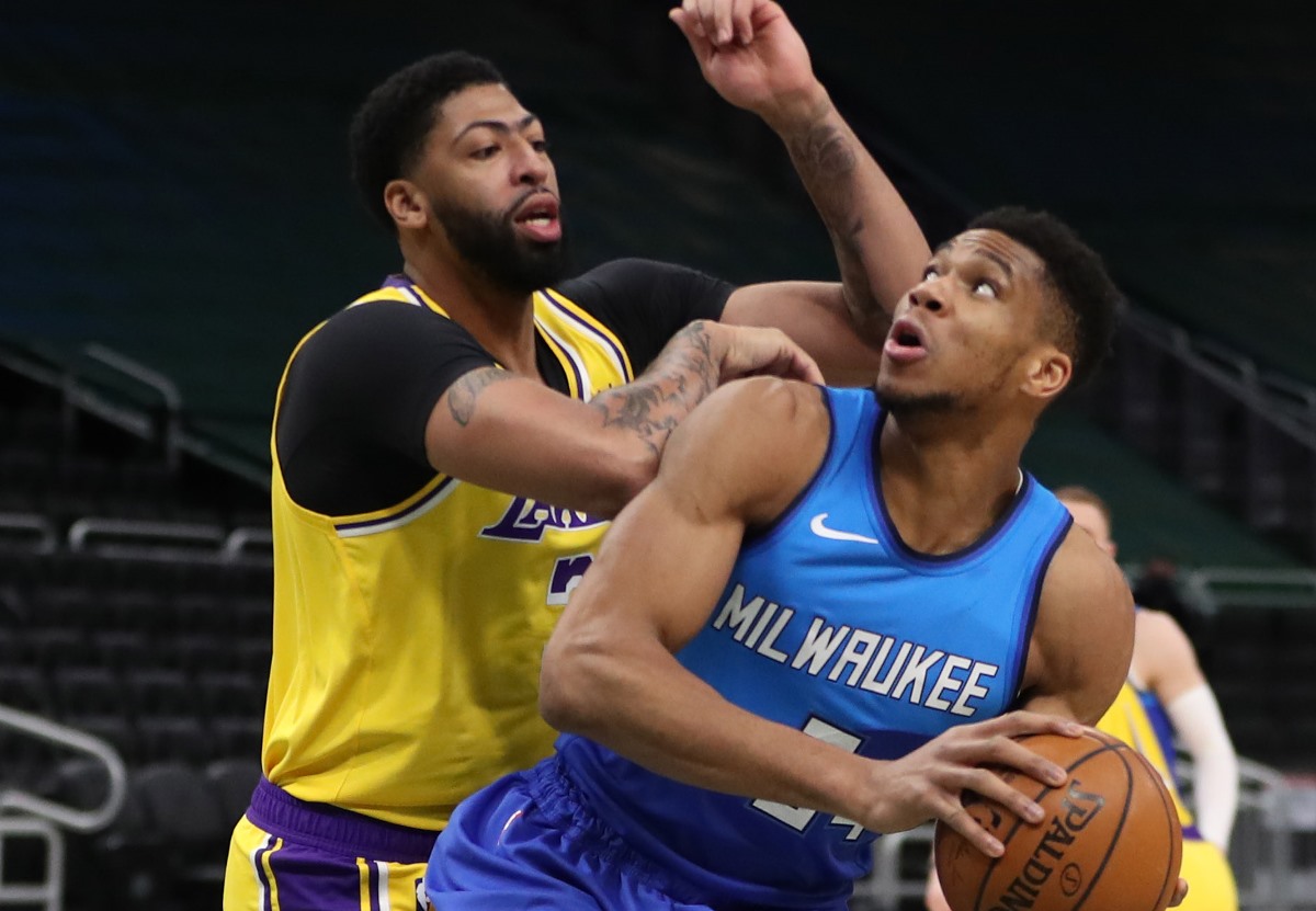 Jan 21, 2021; Milwaukee, WI, USA;  Milwaukee Bucks forward Giannis Antetokounmpo (34) shoots against Los Angeles Lakers forward Anthony Davis (3) at the Bradley Center.  Mandatory Credit: Nick Monroe