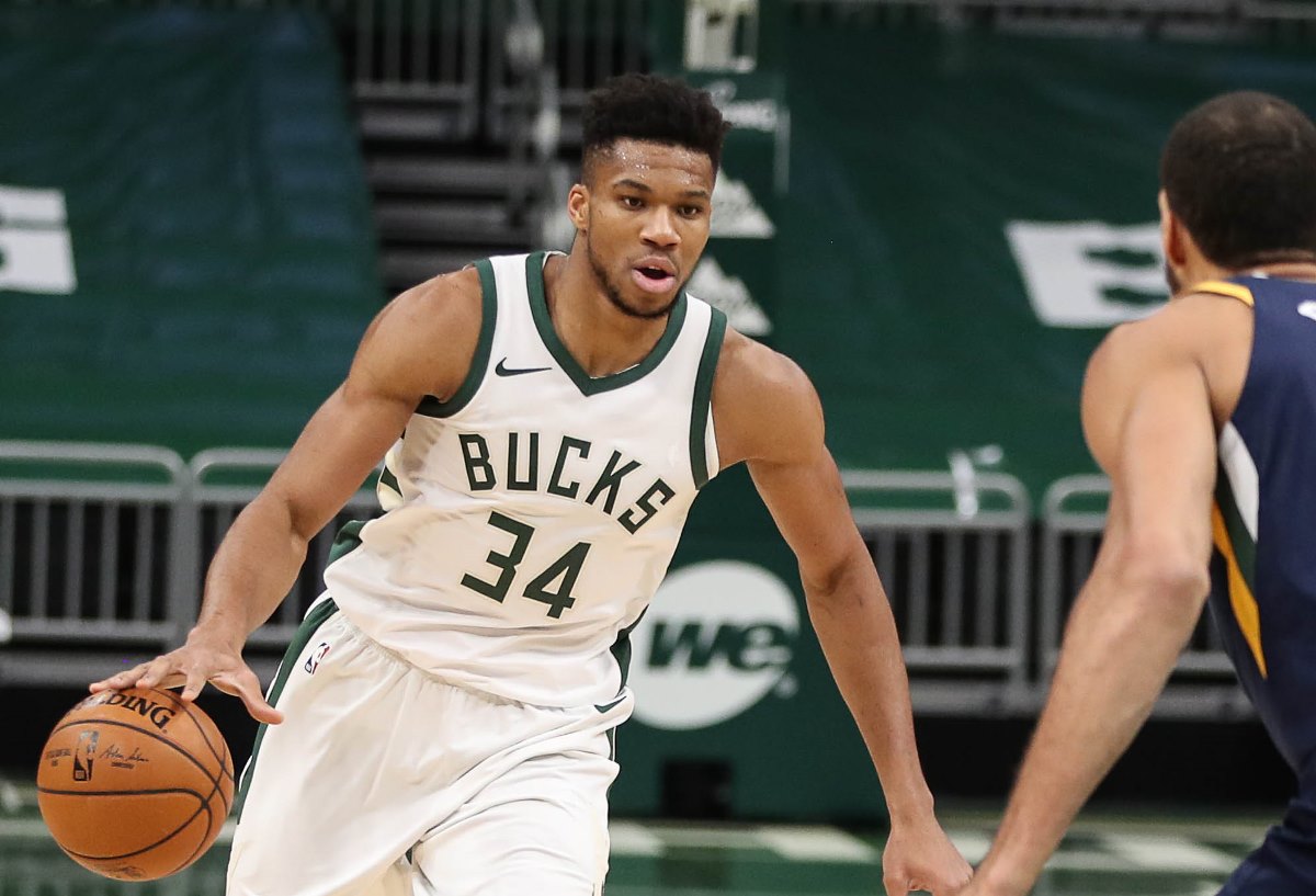 Jan 8, 2021; Milwaukee, WI, USA; Milwaukee Bucks forward Giannis Antetokounmpo (34) is defended by Utah Jazz center Rudy Gobert (27) at the Bradley Center.  Mandatory Credit: Nick Monroe