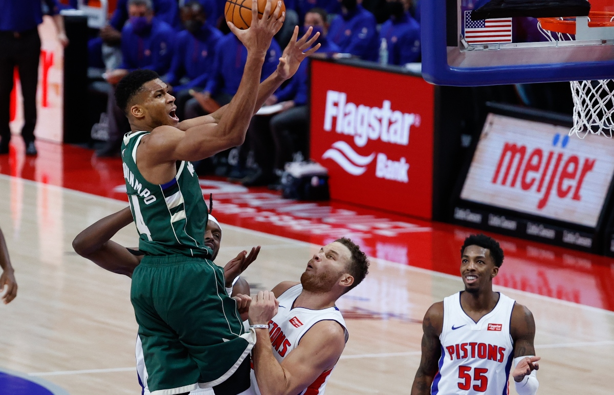 Jan 13, 2021; Detroit, Michigan, USA; Milwaukee Bucks forward Giannis Antetokounmpo (34) goes to the basket while defended by Detroit Pistons forward Blake Griffin (23) in the second half at Little Caesars Arena. Mandatory Credit: Rick Osentoski-USA TODAY Sports