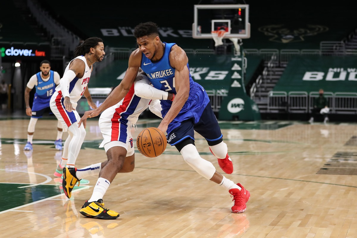 Jan 4, 2021; Milwaukee, WI, USA; Milwaukee Bucks forward Giannis Antetokounmpo (34) drives against Detroit Pistons guard Saddiq Bey (41) at the Bradley Center.  Mandatory Credit: Nick Monroe