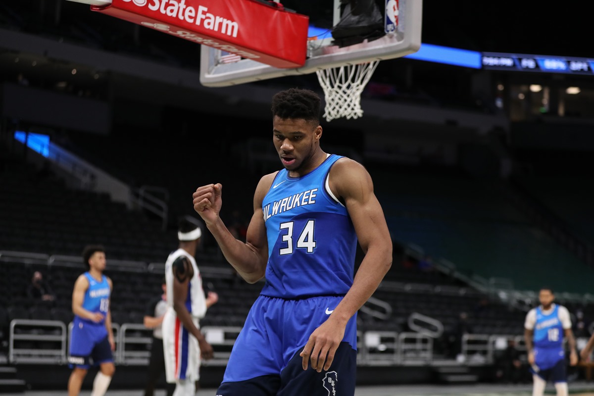 Jan 4, 2021; Milwaukee, WI, USA; Milwaukee Bucks forward Giannis Antetokounmpo (34) reacts after scoring against the Detroit Pistons at the Bradley Center.  Mandatory Credit: Nick Monroe